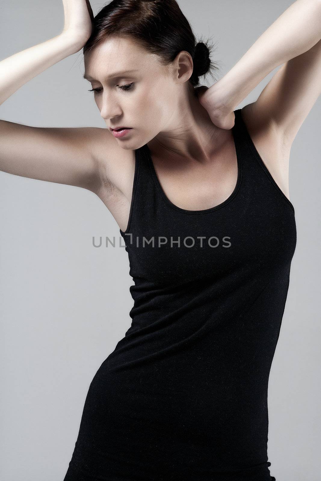 Woman wearing a little black dress on an isolated bakground