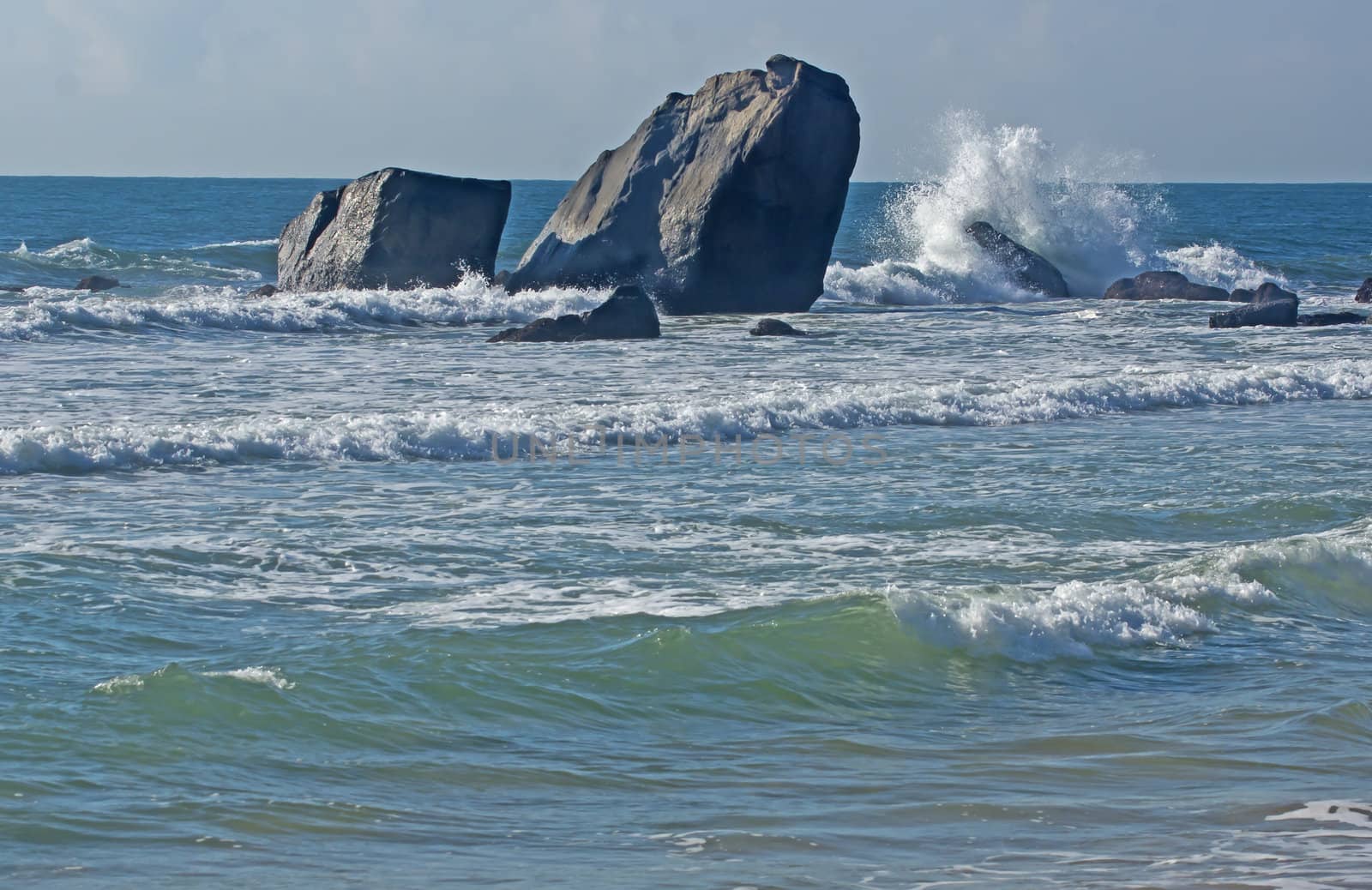 The sea and the sky, the white waves, black rocks, very beautiful