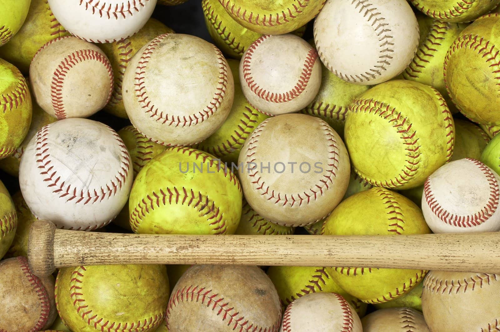 a picture of baseballs and softballs