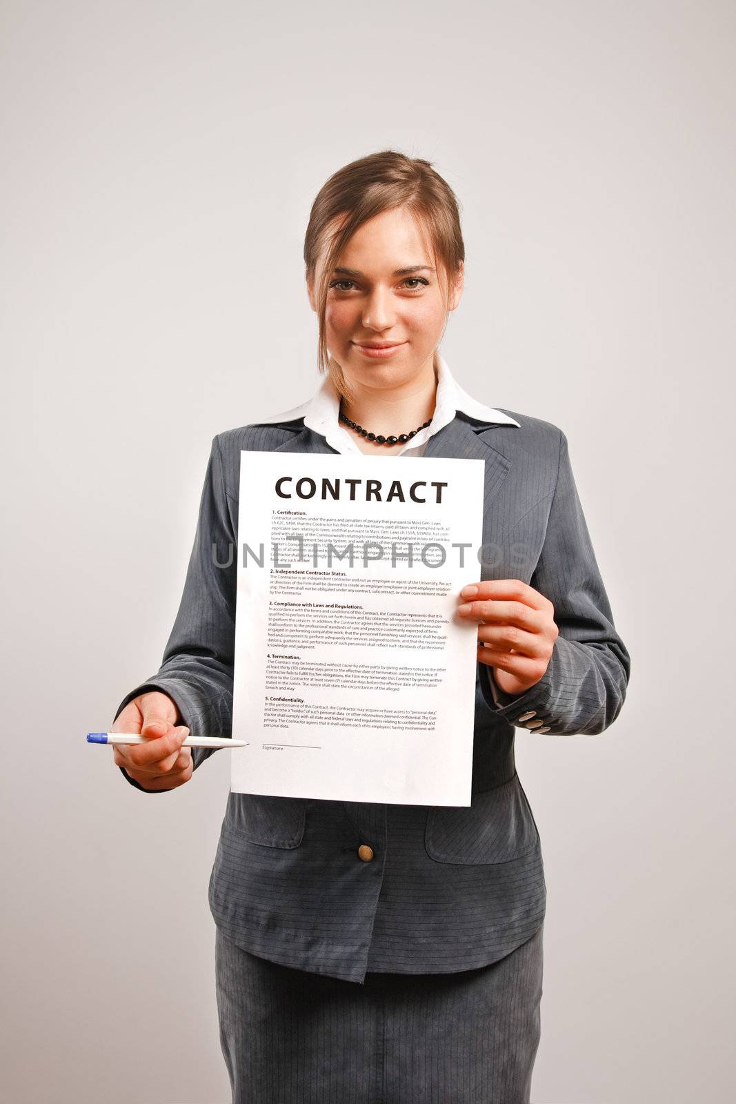 Business woman holding a printed contract