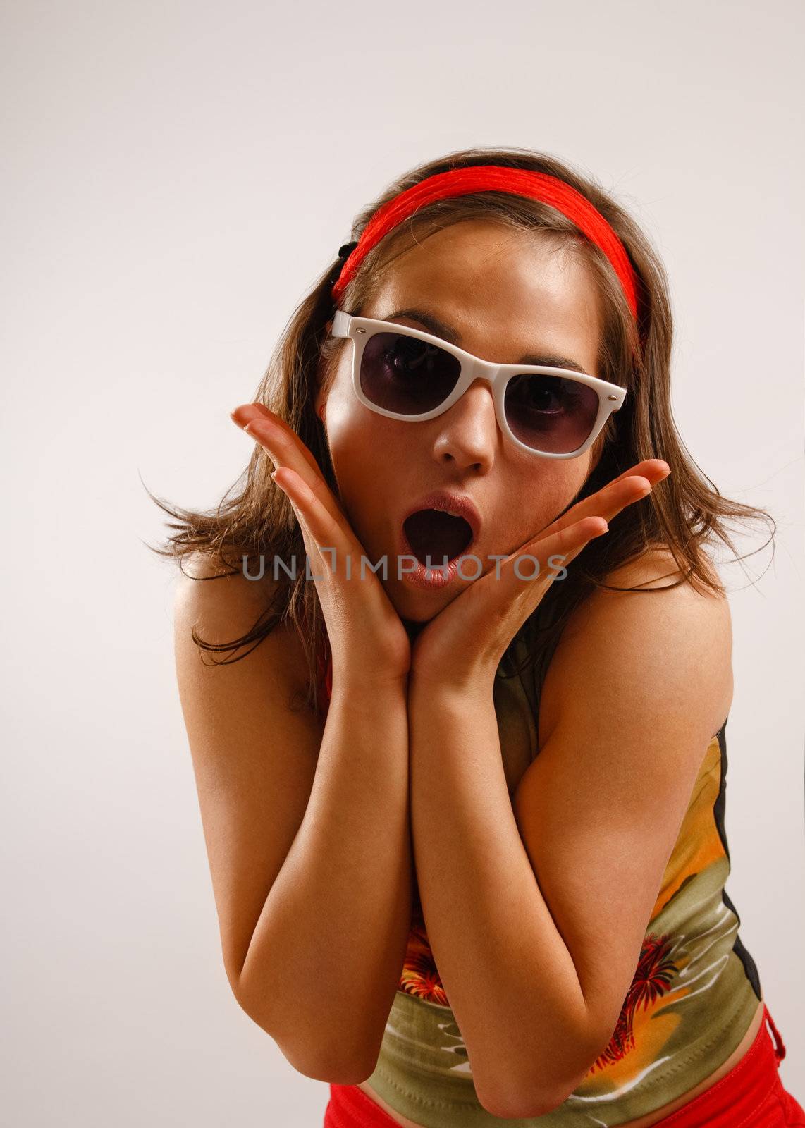 Modern looking young woman wearing sun glasses