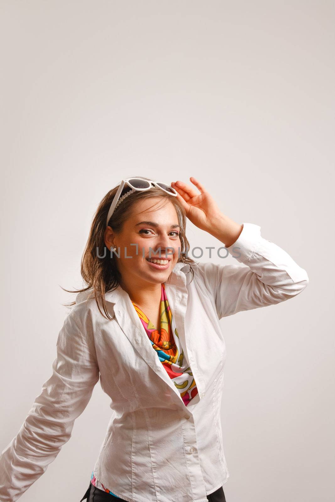 Beautiful young woman wearing white jacket by photovibes