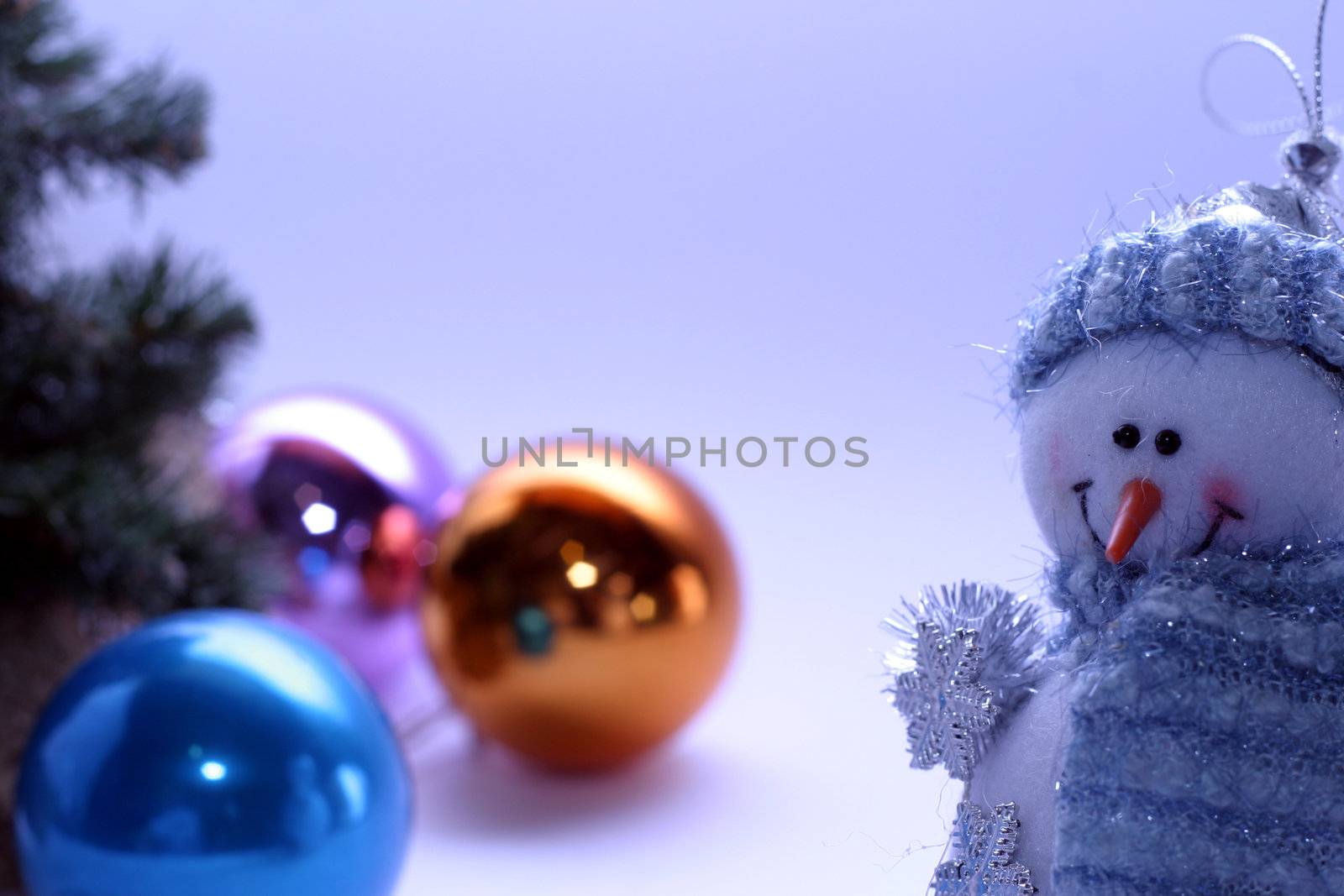 Christmas card with a snowman and christmas-tree decorations