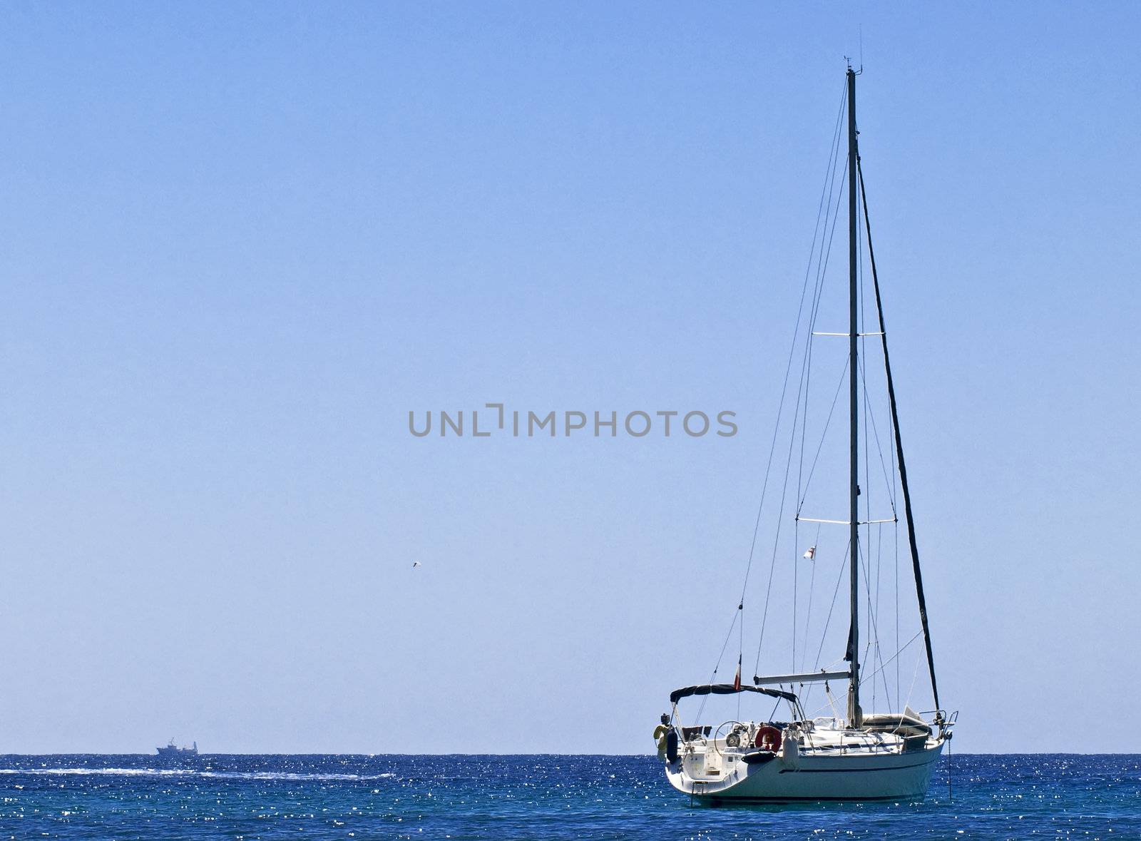 Yacht sailing across the deep blue azure waters of the Mediterranean Sea