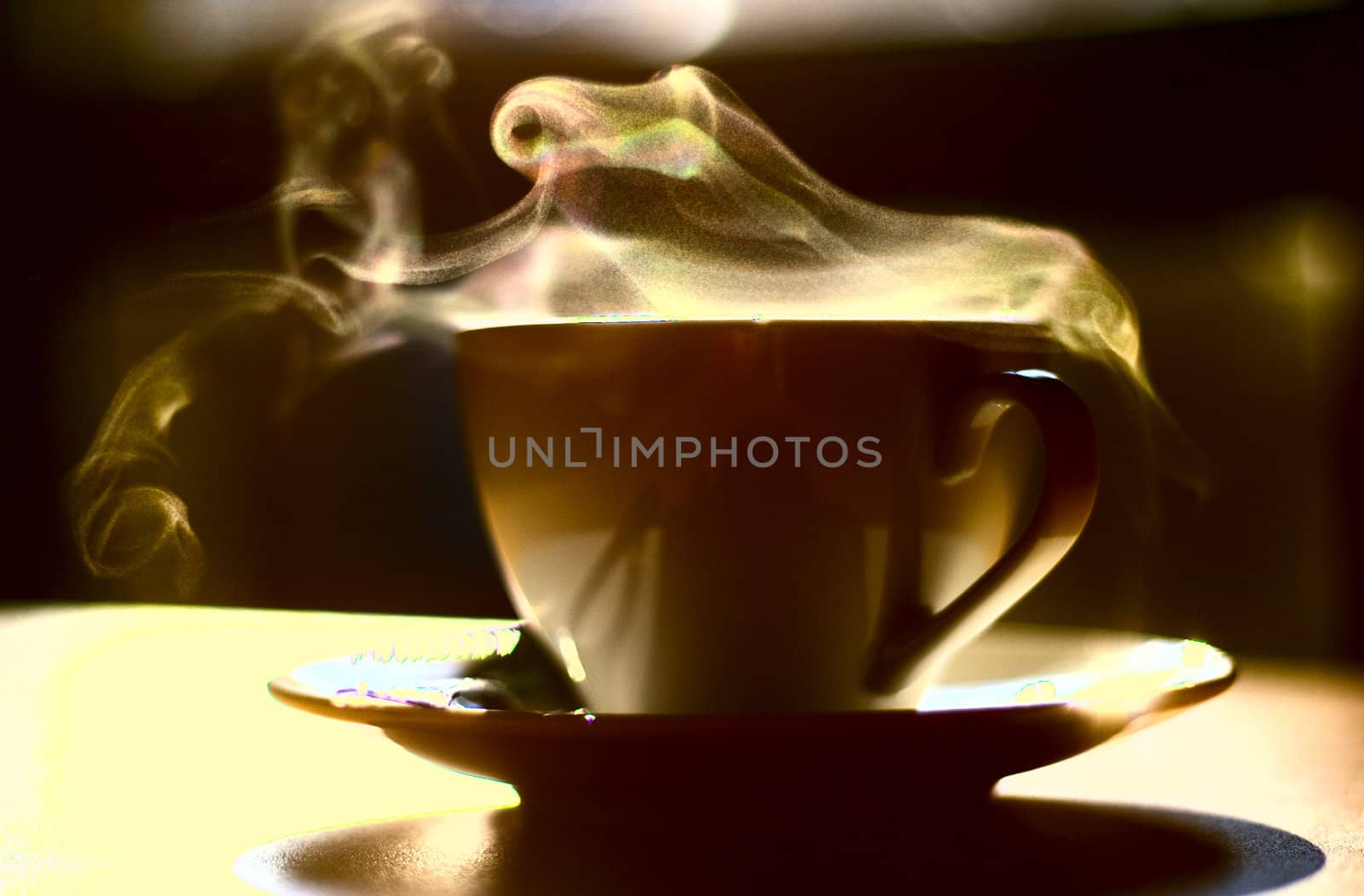 Hot coffee. Little depth of field to focus on feeling the heat. Extreme colors to emphasize the idea