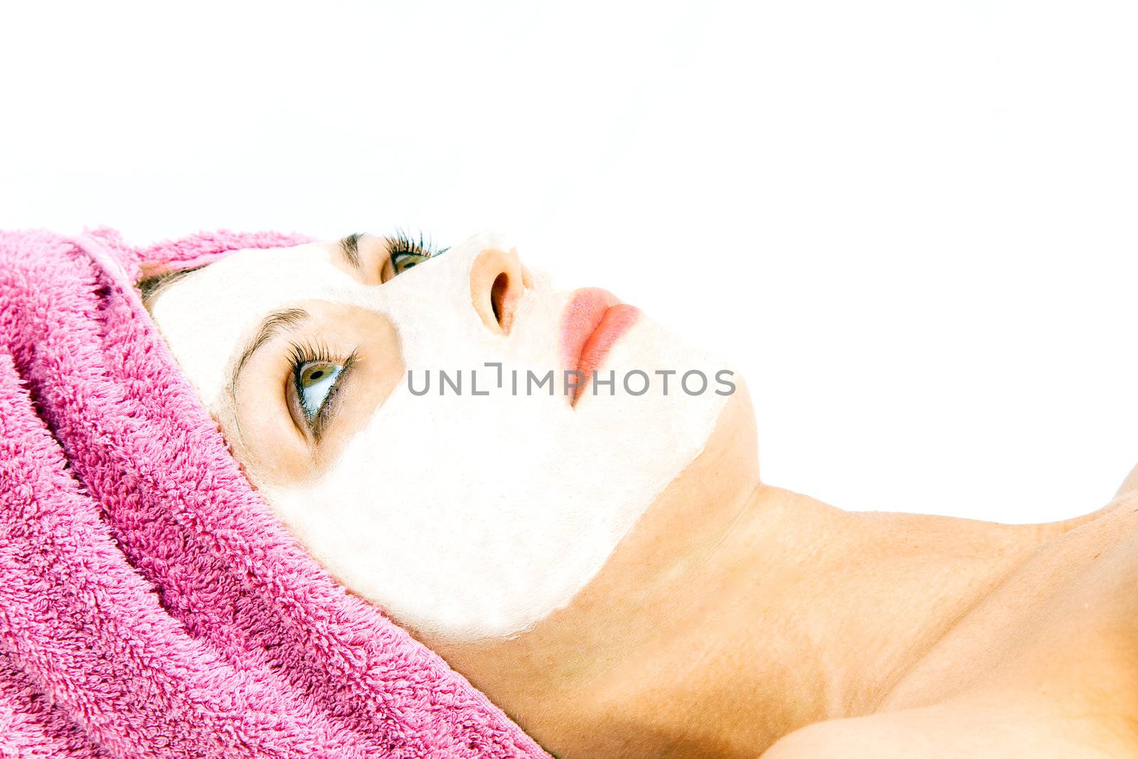 Beautiful woman during the spa treatment isolated on white.