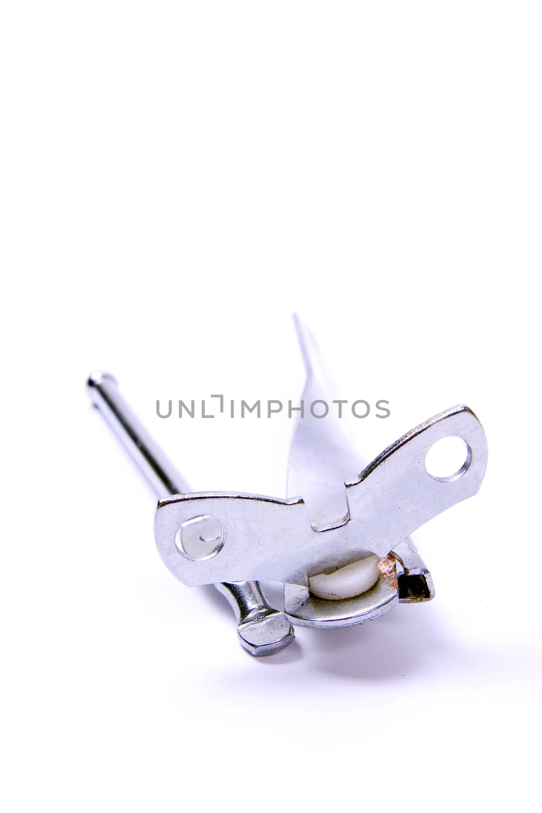 Hand operated can opener, isolated against white background