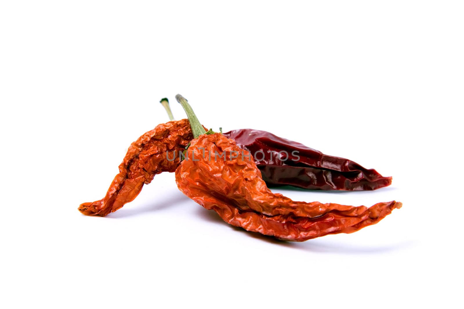 Dried-up red paprika isolated on white.