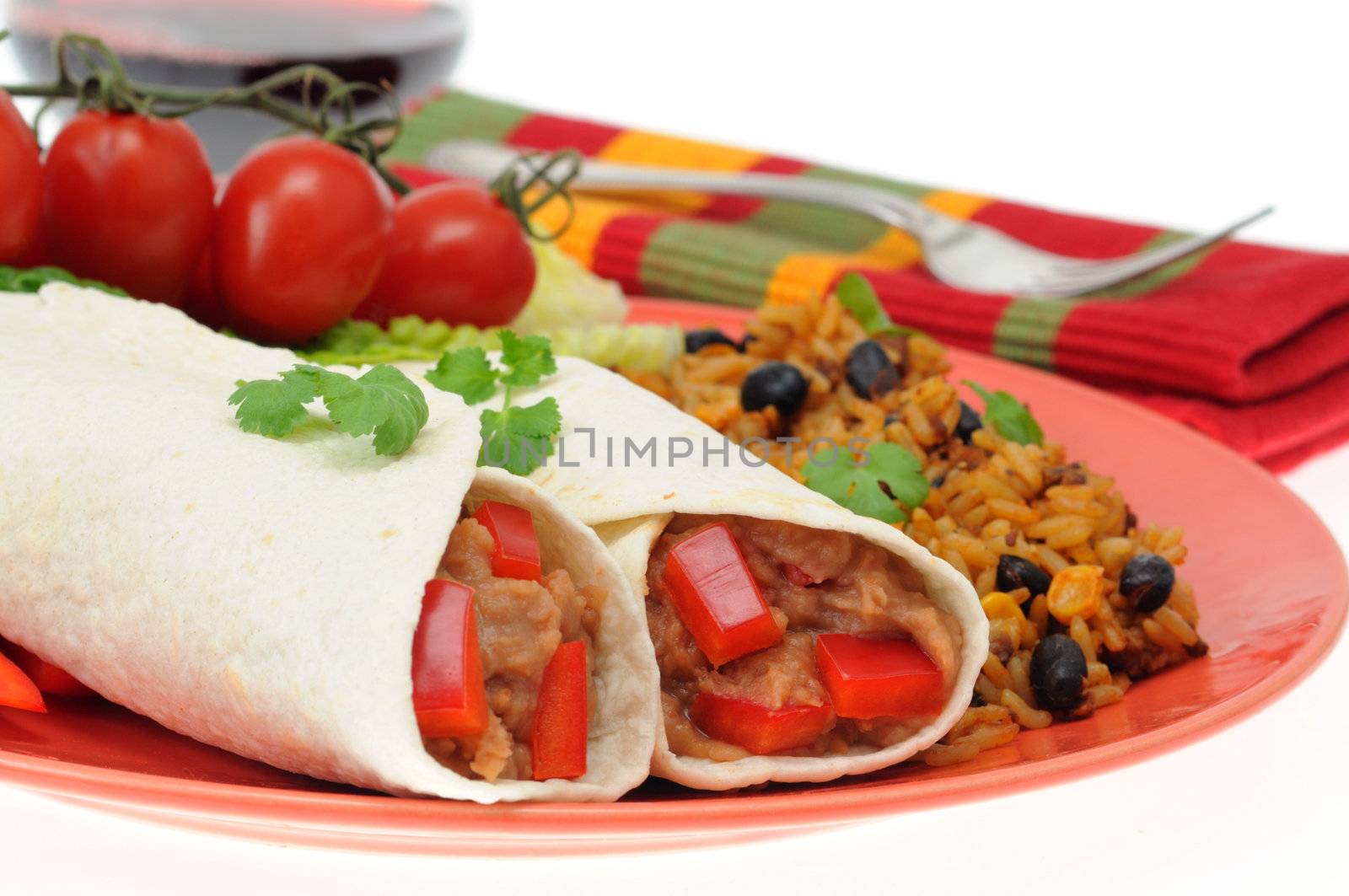 Delicious bean burrito served with mexican style rice.
