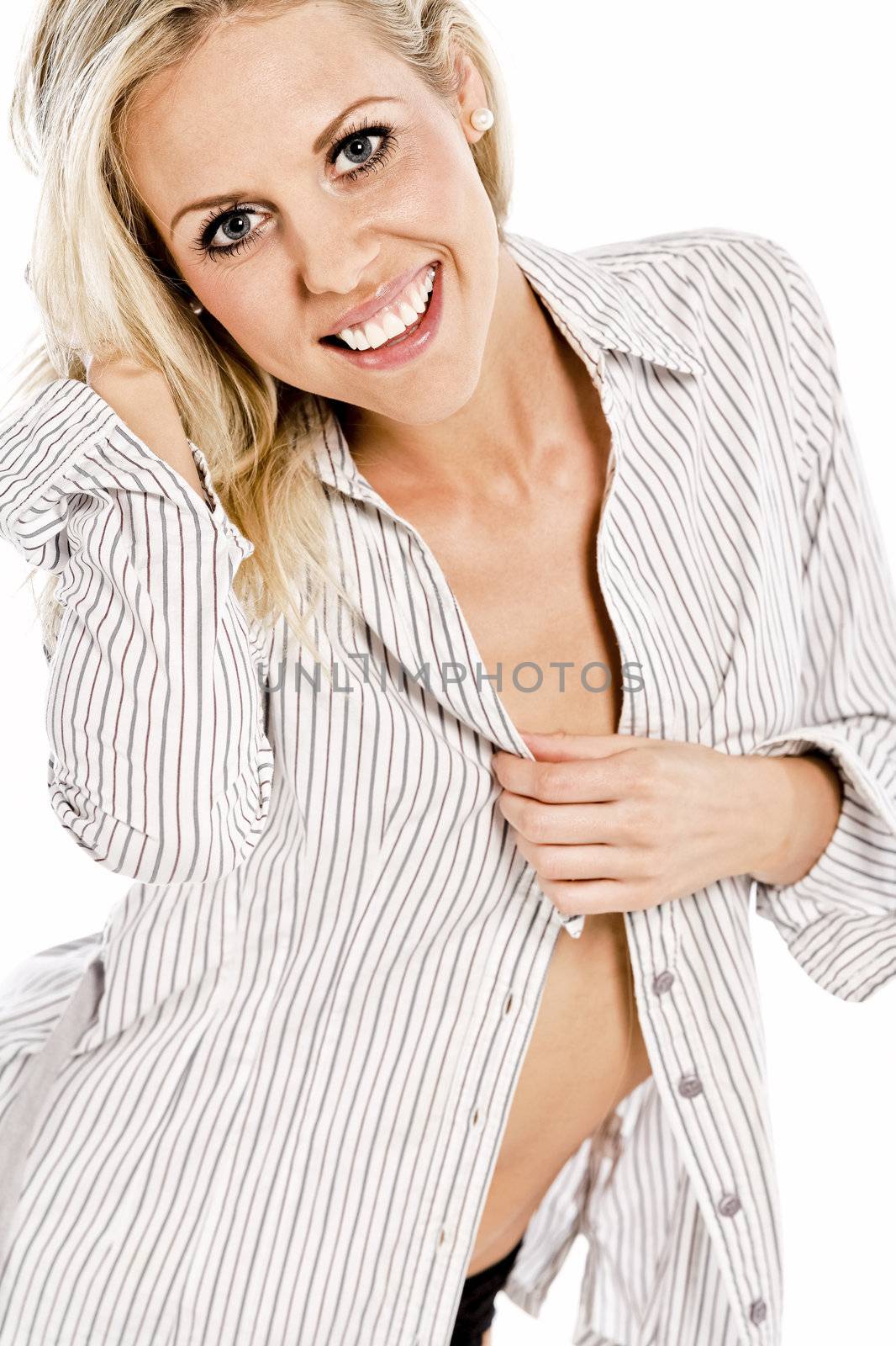 Beautiful young woman in shirt and underwear on white background