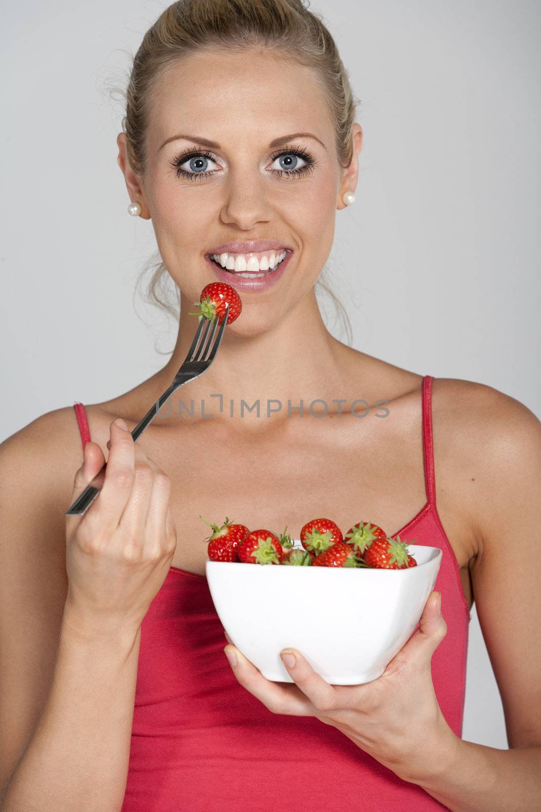 Woman eating fresh fruit by studiofi