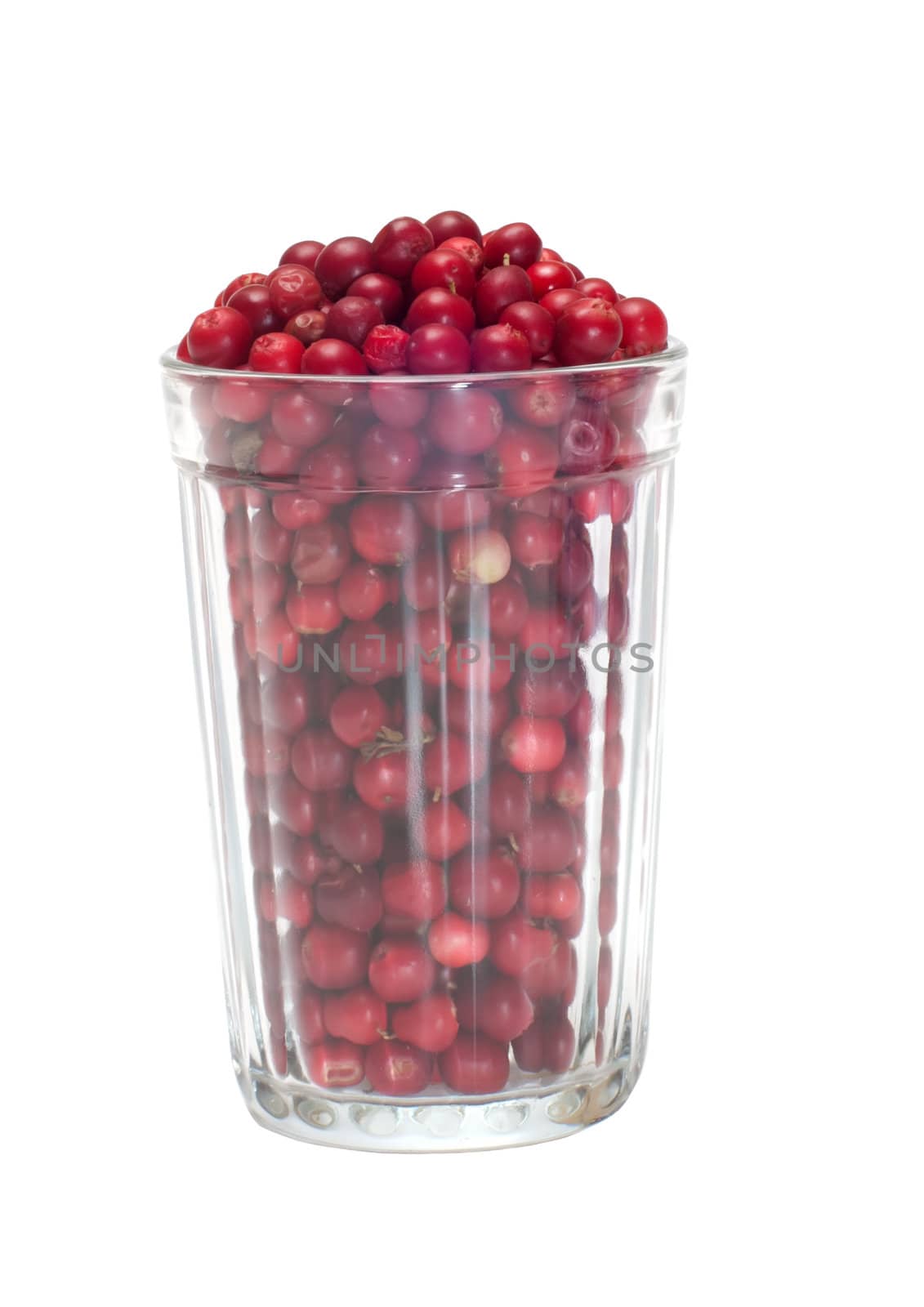 Glass filled with a cowberry isolated on white.