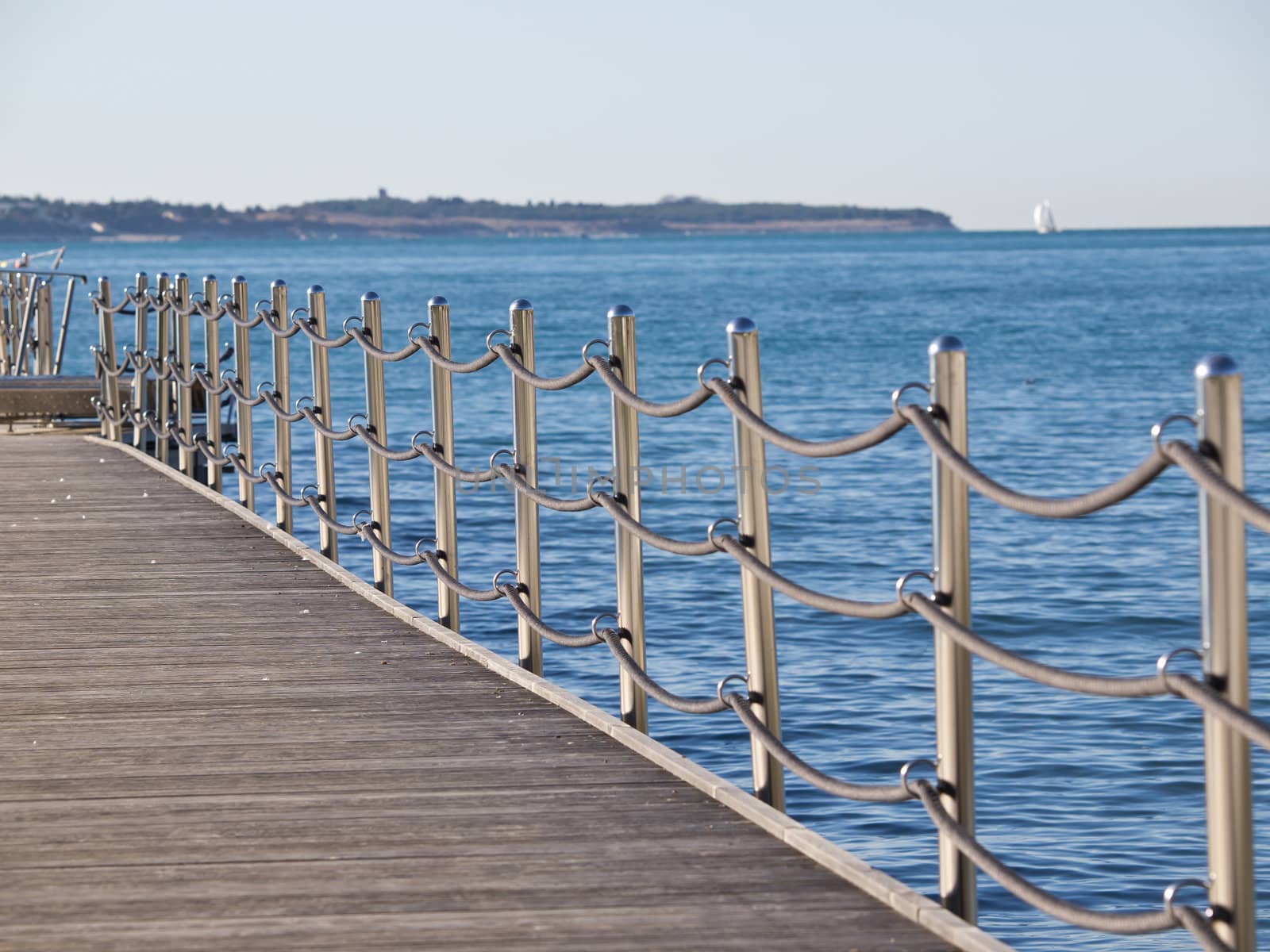 stainless steel  fence with ropes on the sea