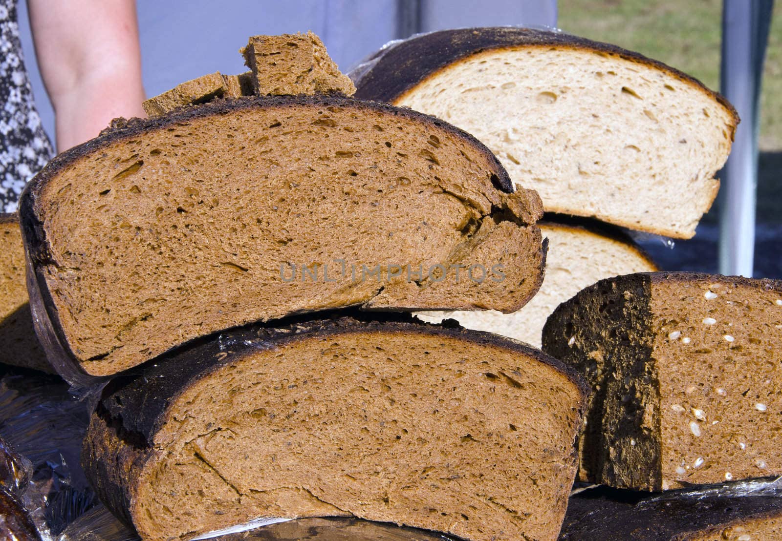 Fresh baked rustic bread sold in street fair market.