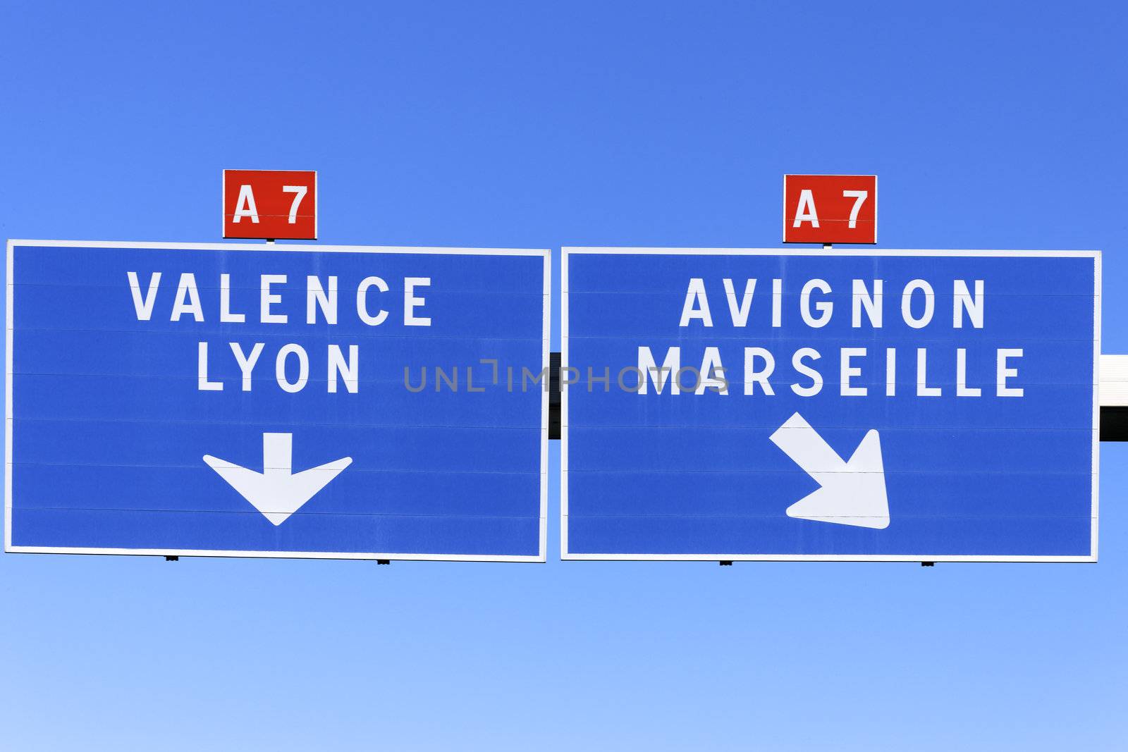 A French road sign pointing the way to marseille, valence, avignon and lyon.