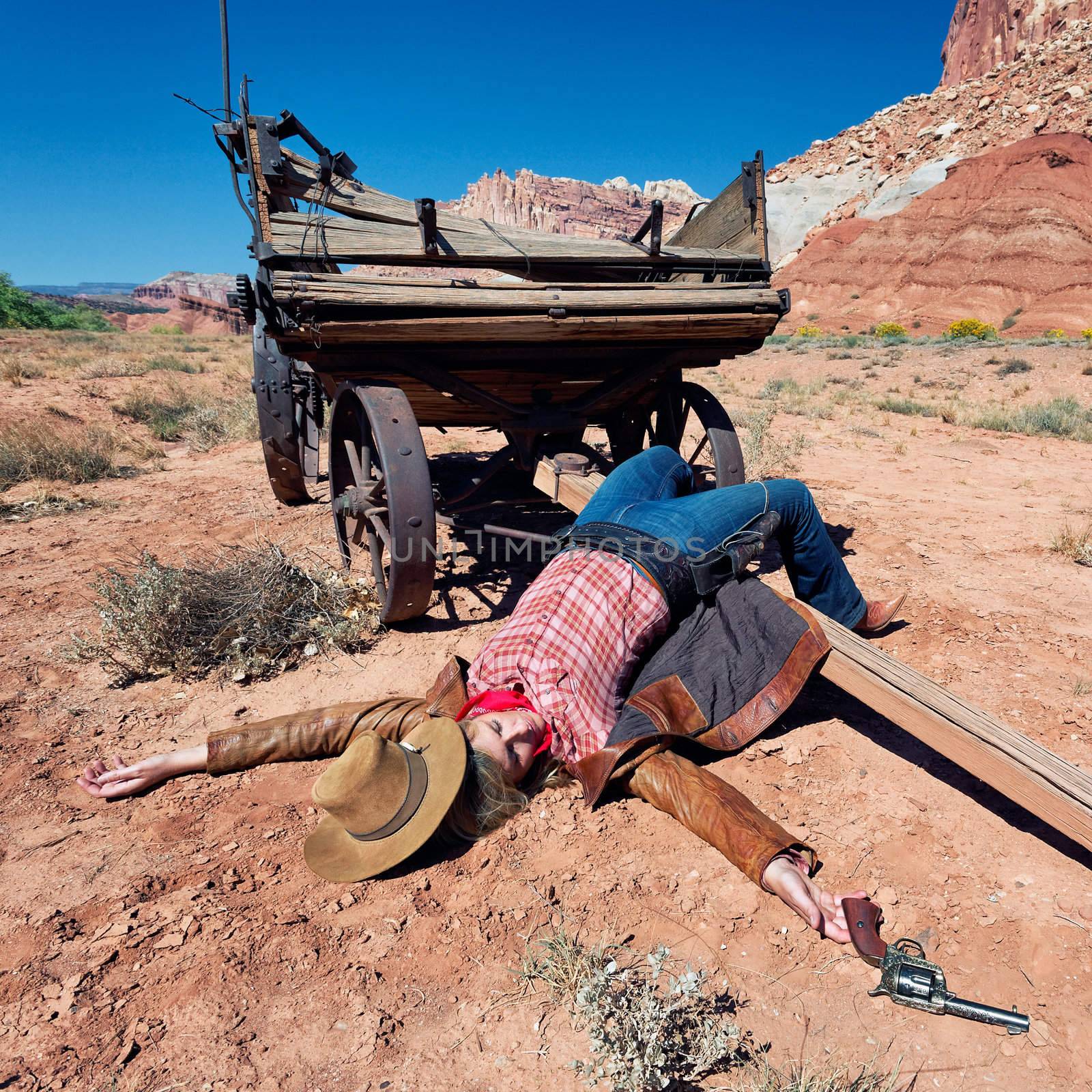 dead cowgirl lying on the floor, western spirit