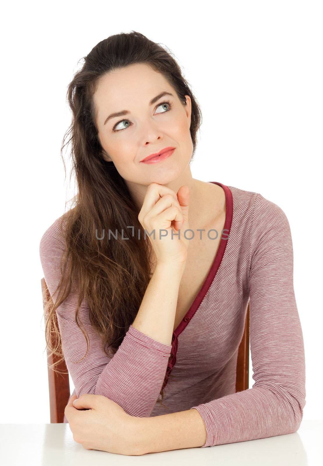 Close-up portrait of a contemplative young woman looking away. Isolated on white.