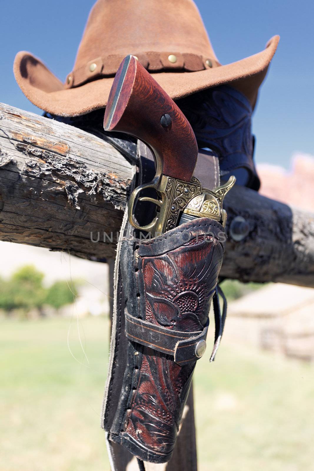 gun and hat outdoor under sunlight