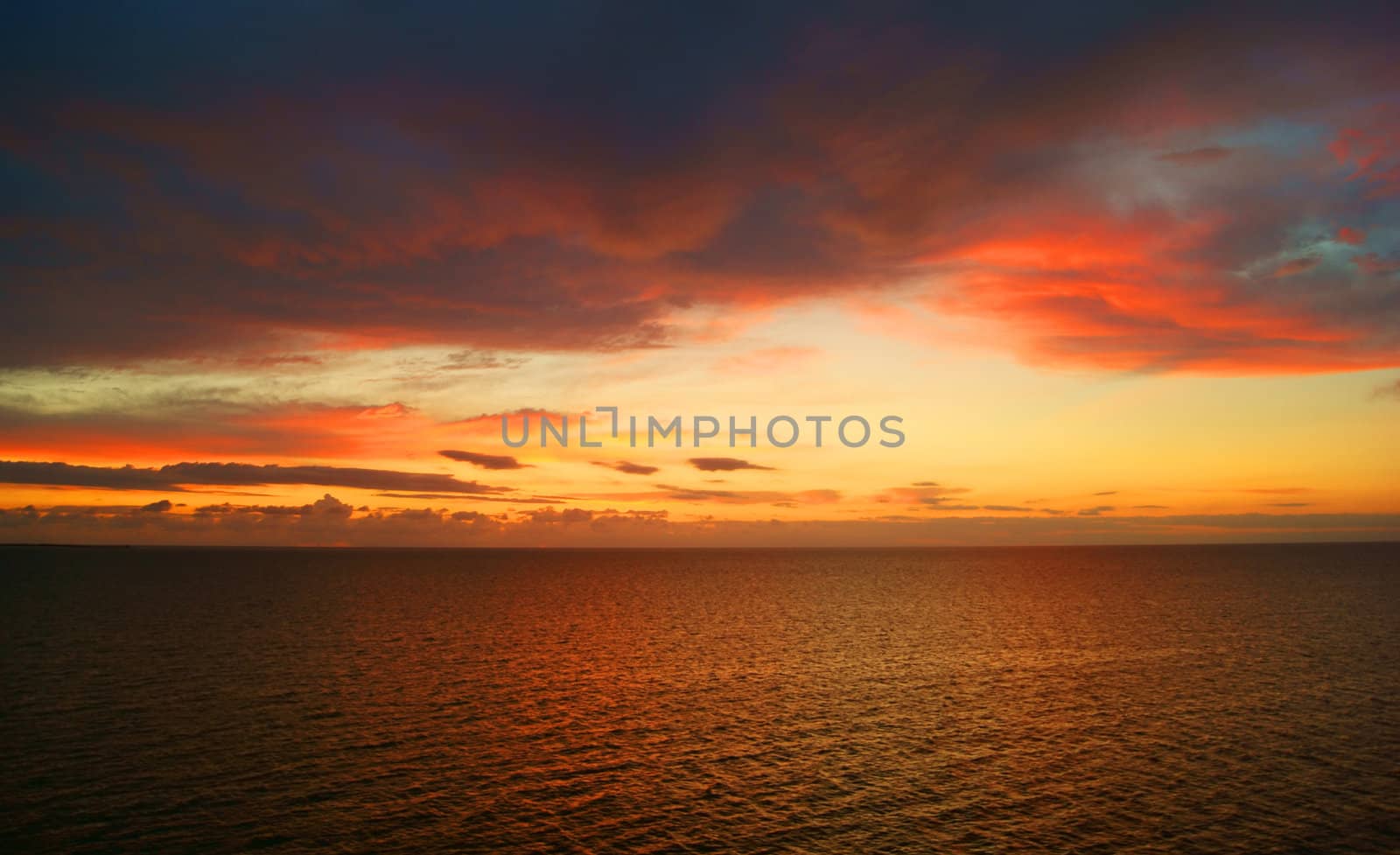 View on sunlit clouds in setting sun