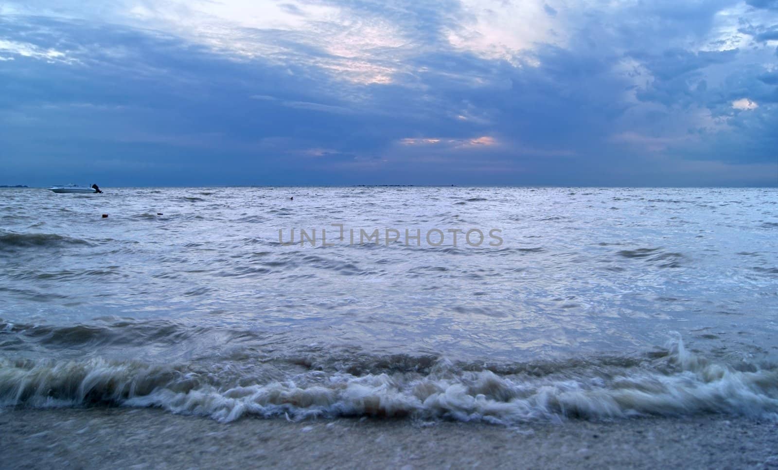 View on sea and clouds before storm in twilight