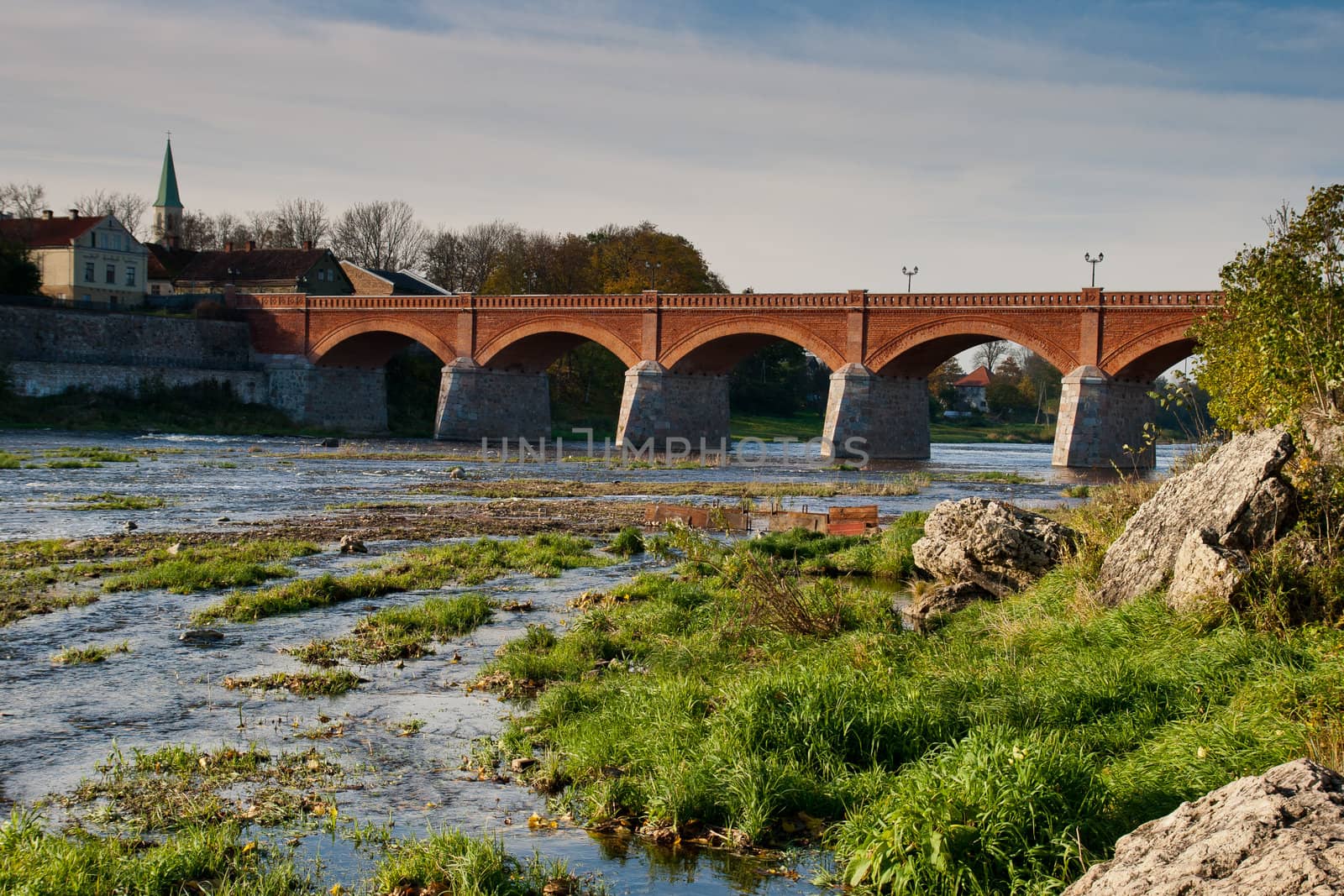 Old brick bridge over river Venta in Kuldiga, Latvia