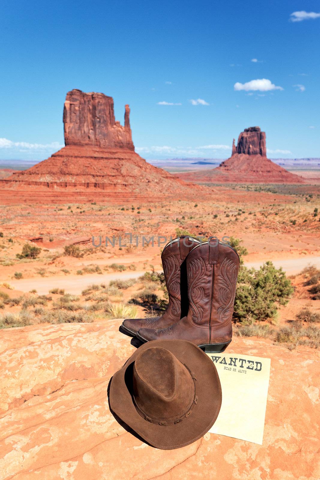 boots and hat in front of Monument Valley, USA