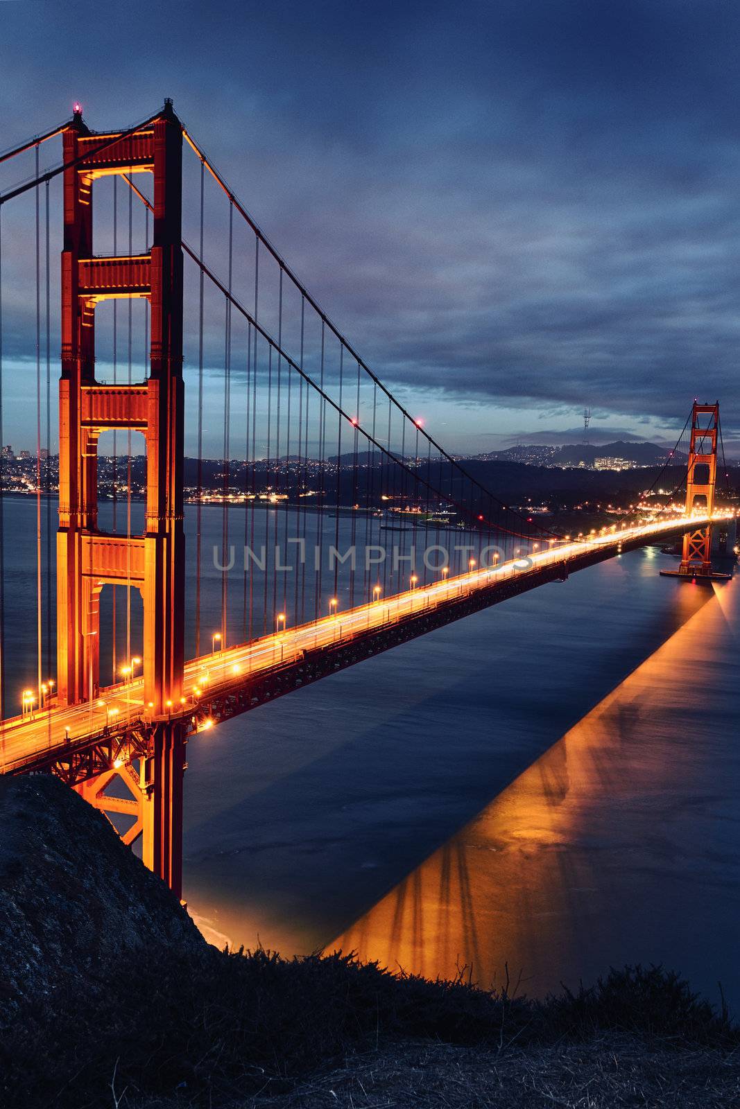 Golden Gate Bridge and San Francisco lights at sunset