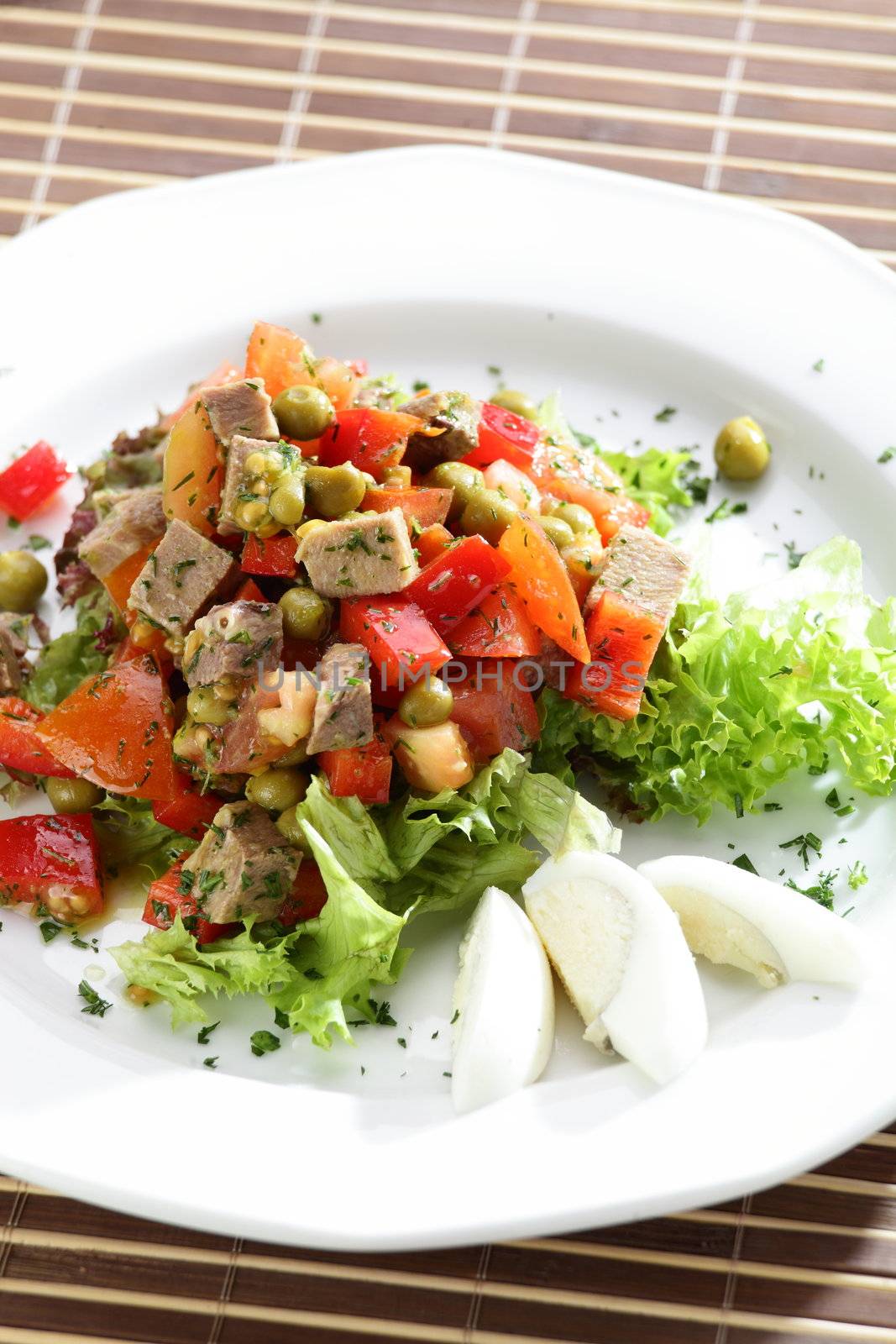 Fresh and tasty salad on the wooden table