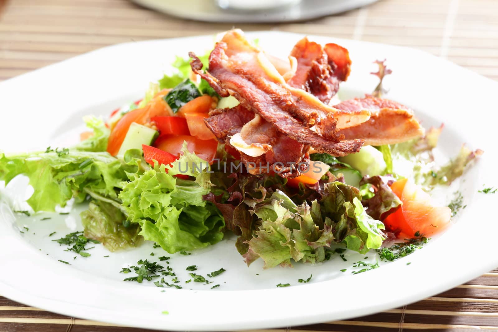 Fresh and tasty salad on the wooden table