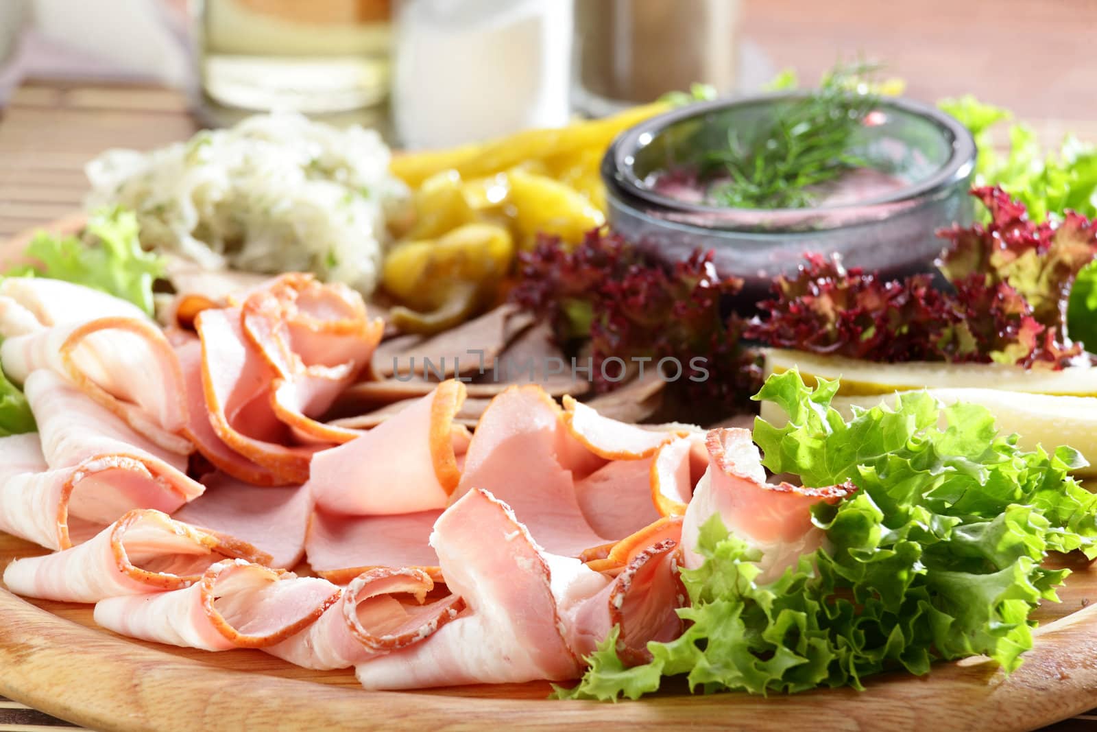 Fresh cold cuts on the wooden plate