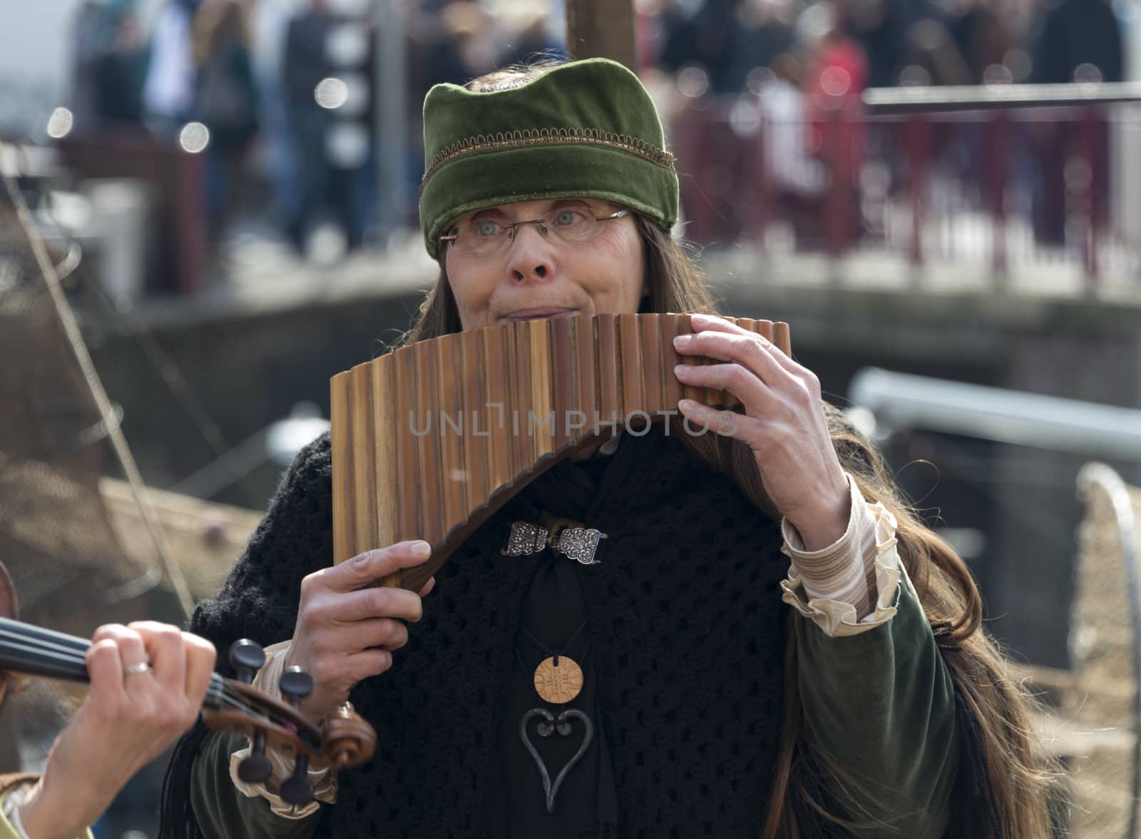 BRIELLE,HOLLAND APRIL 01:Woman playing panflute on the market on April 01, 2013 in Brielle,Holland.This is the party of the point in the uprising of Low Countries against Spain in the 80 Years' War
