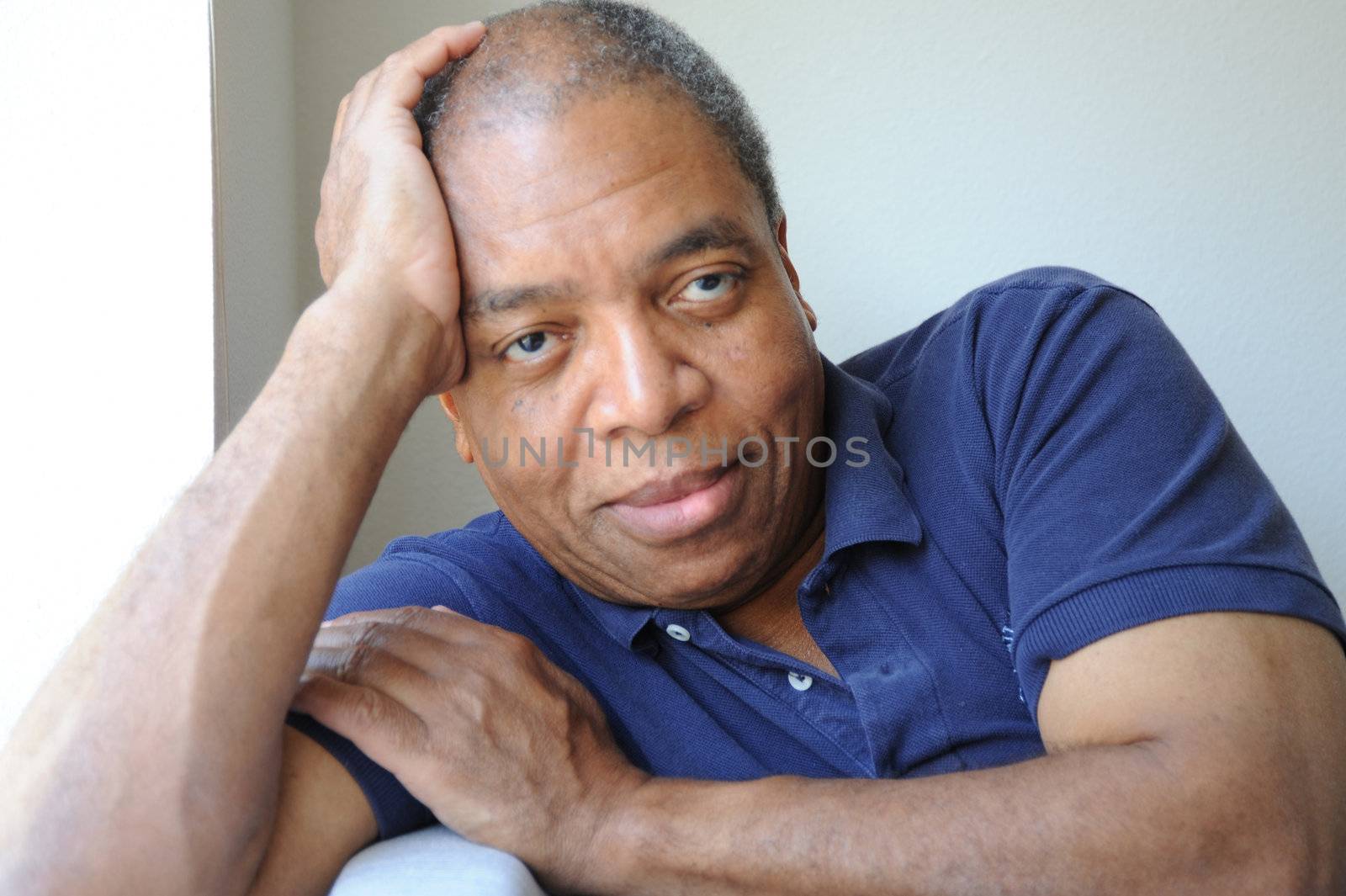 African American male expressions indoors.