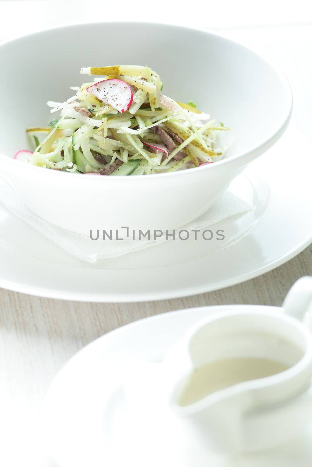 Fresh and tasty salad in white dish