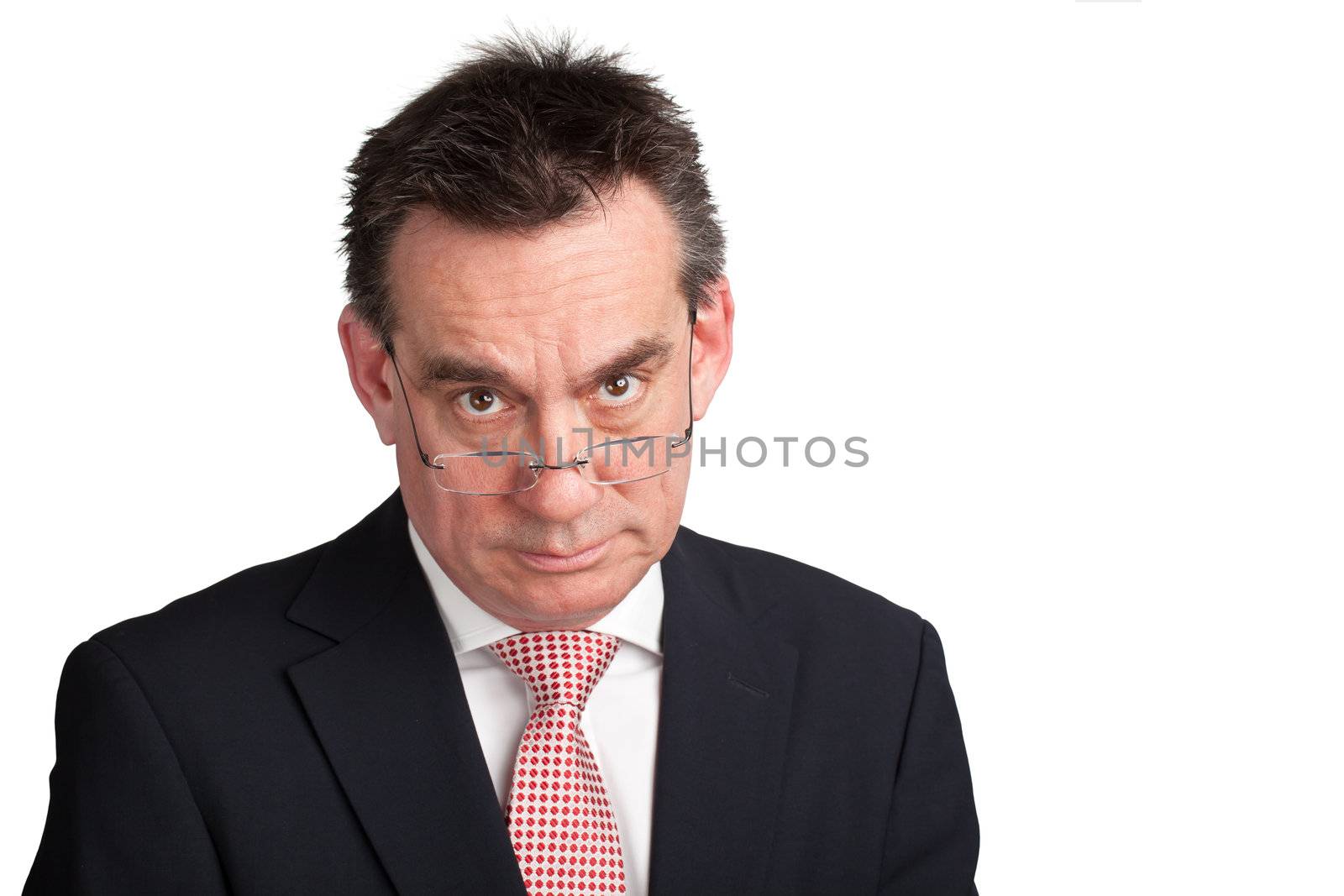 Stern Middle Age Business Man looking over Spectacles Isolated