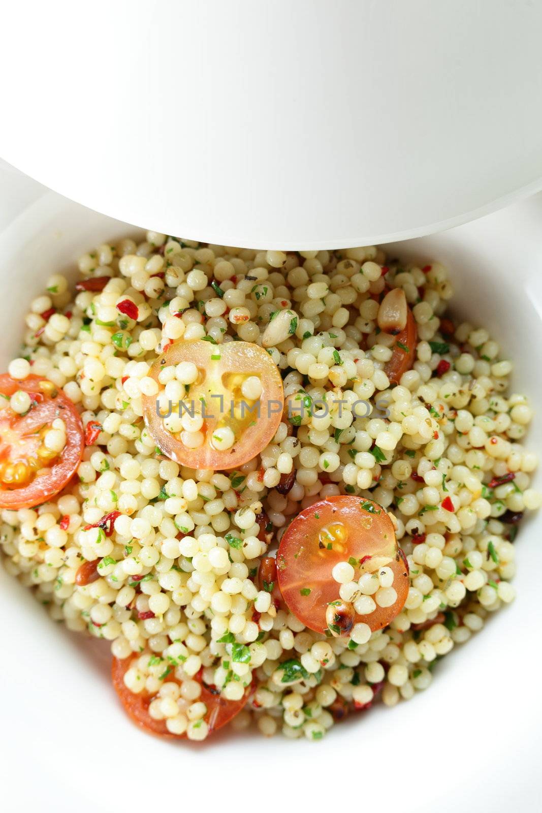 Millet in the white dish on wooden table