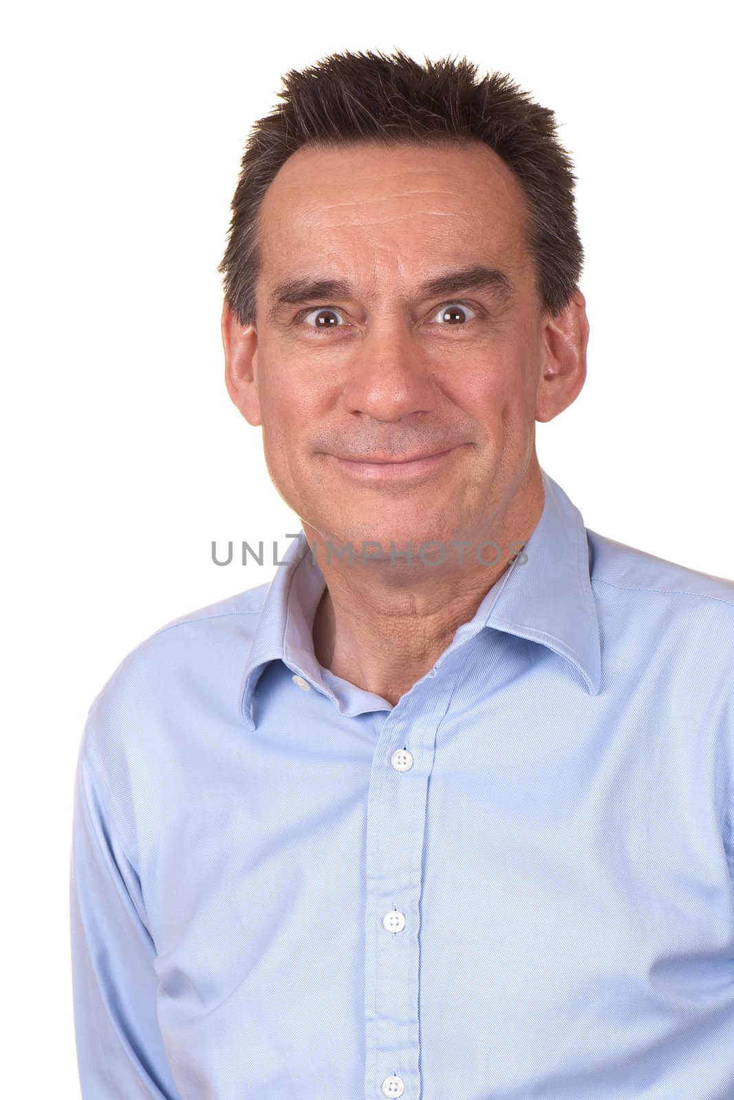 Attractive Middle Age Man in Blue Shirt with Silly Smile and Funny Expression Isolated