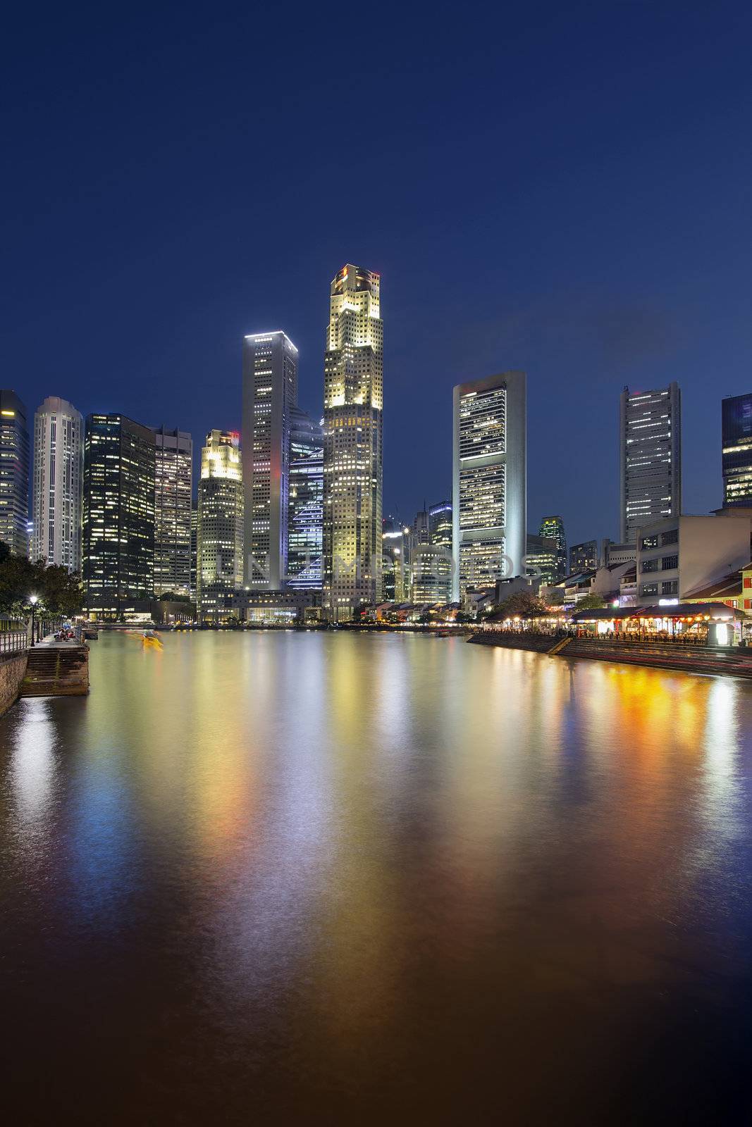 Singapore Central Business District (CBD) City Skyline by Boat Quay Along Singapore River at Blue Hour Vertical