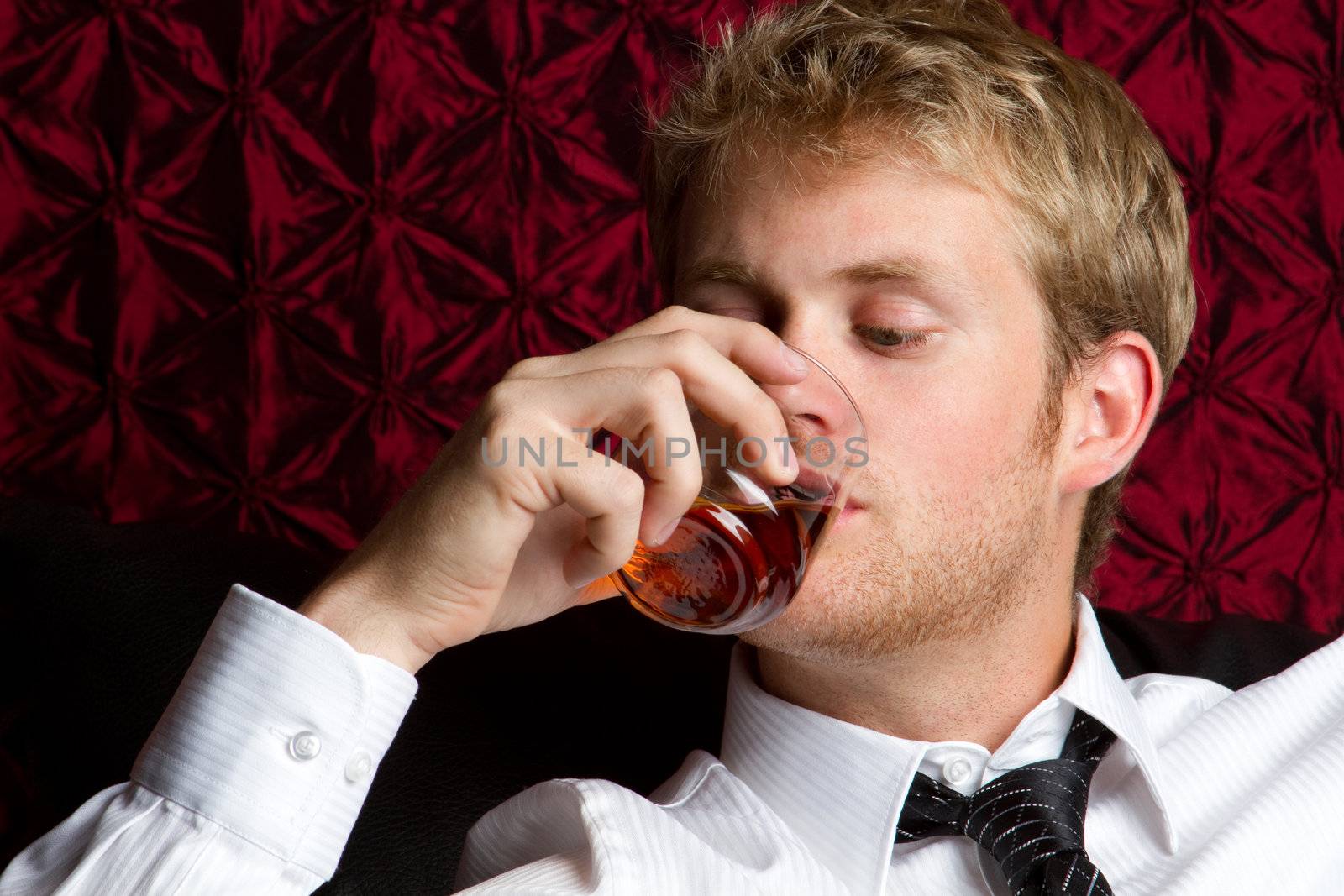 Business man drinking scotch alcohol