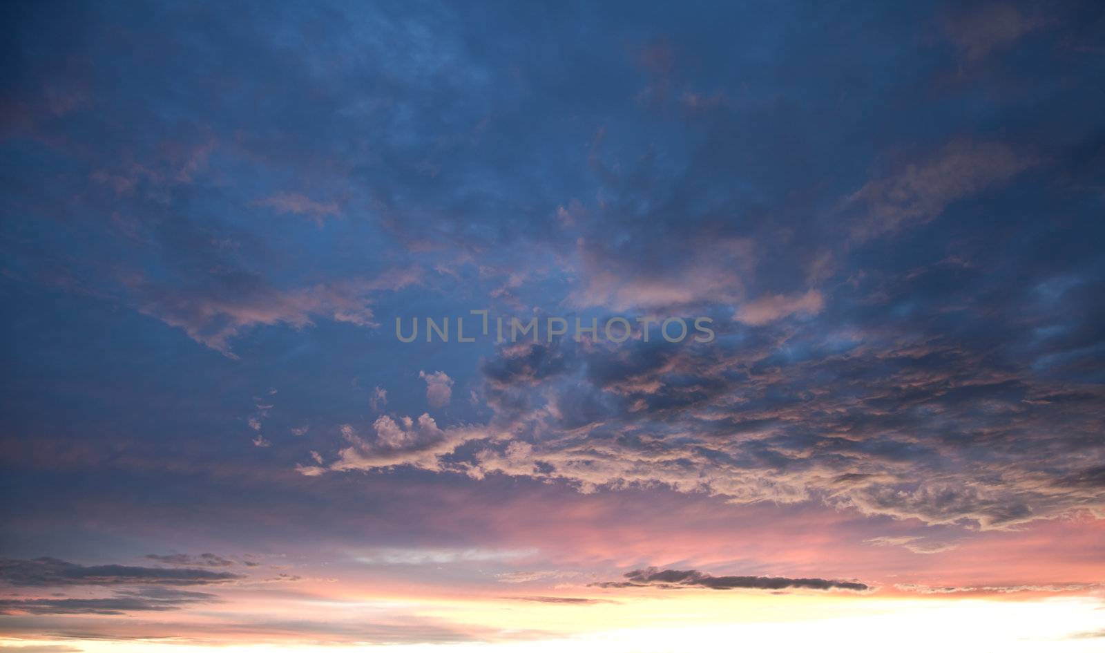 Beautiful blue and pink sky at dusk right after sunset.