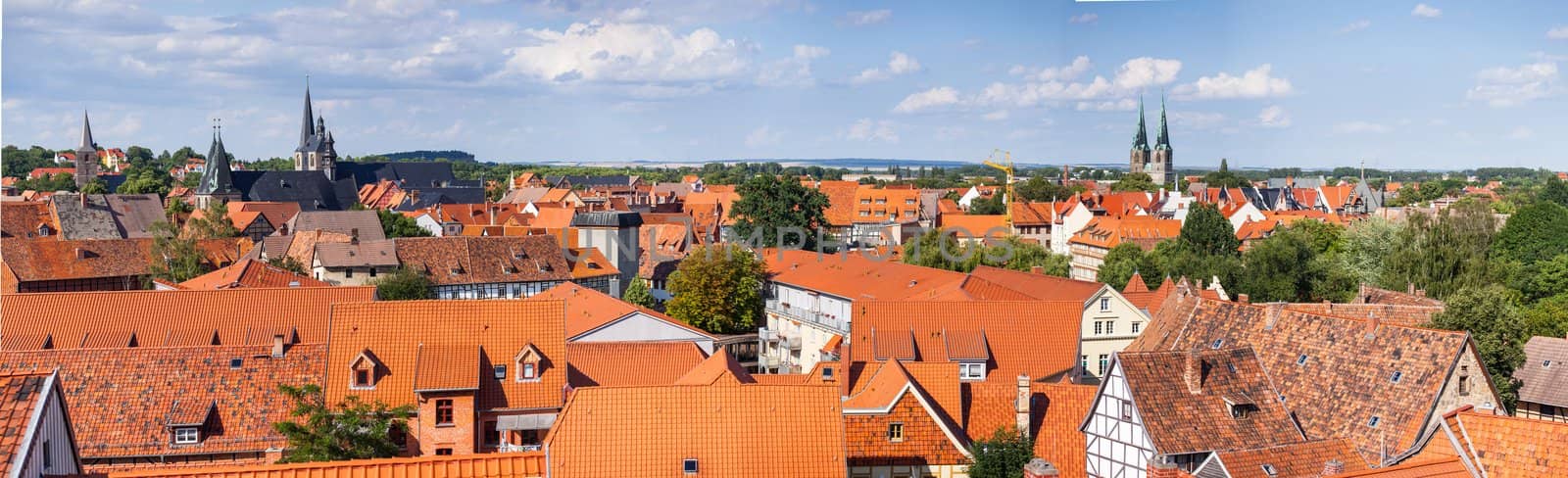 Bird's eye view of the tiled roofs of medieval houses in the historical center of europe city. Panoramic view