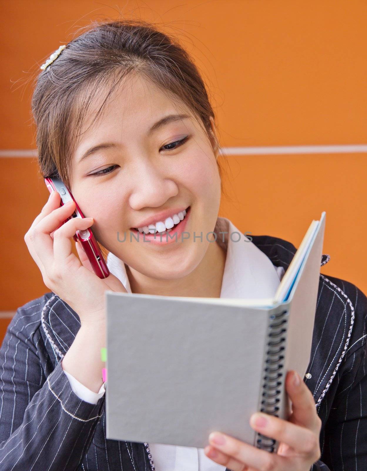 Business woman talking on the phone by Myimagine