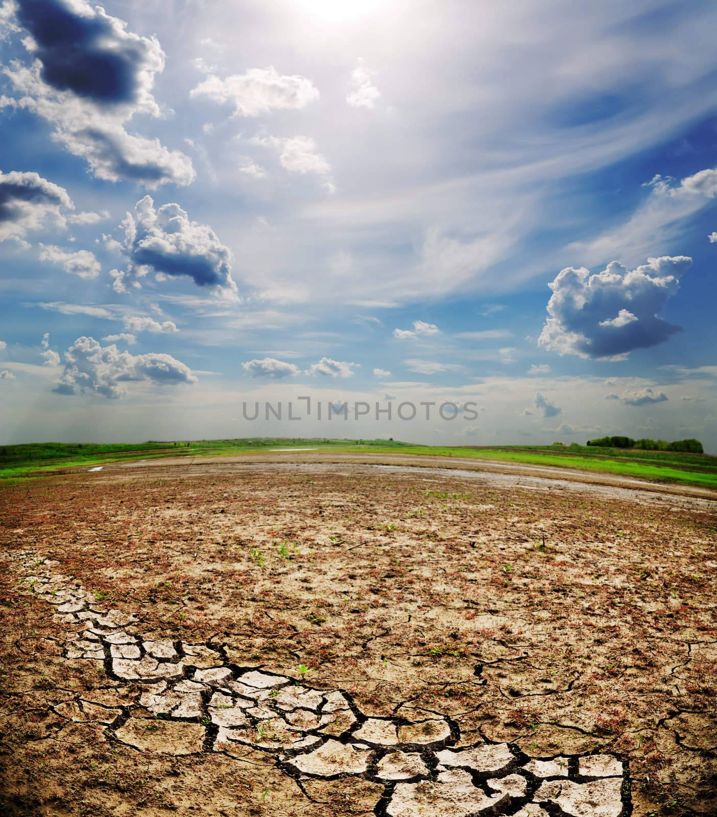 dramatic sky over dry cracked earth