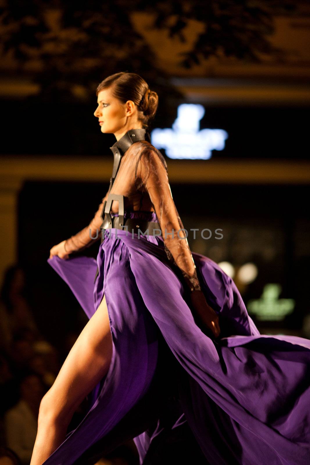 PRAGUE-SEPTEMBER 24: A model walks the runway during the 2011 autumn/winter Nina Ricci Paris Collection by Obsession during the Prague Fashion Weekend on September 24, 2011 in Prague, Czech Republic.