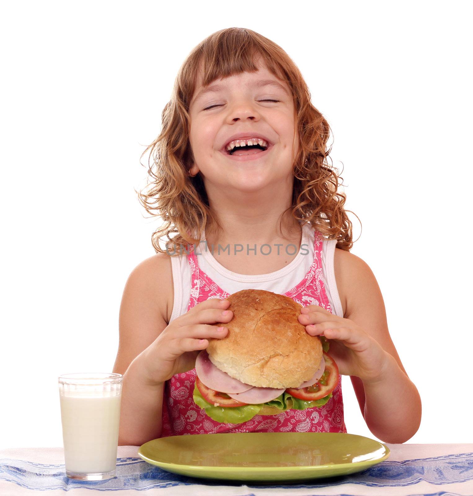 happy little girl eat big sandwich breakfast time by goce