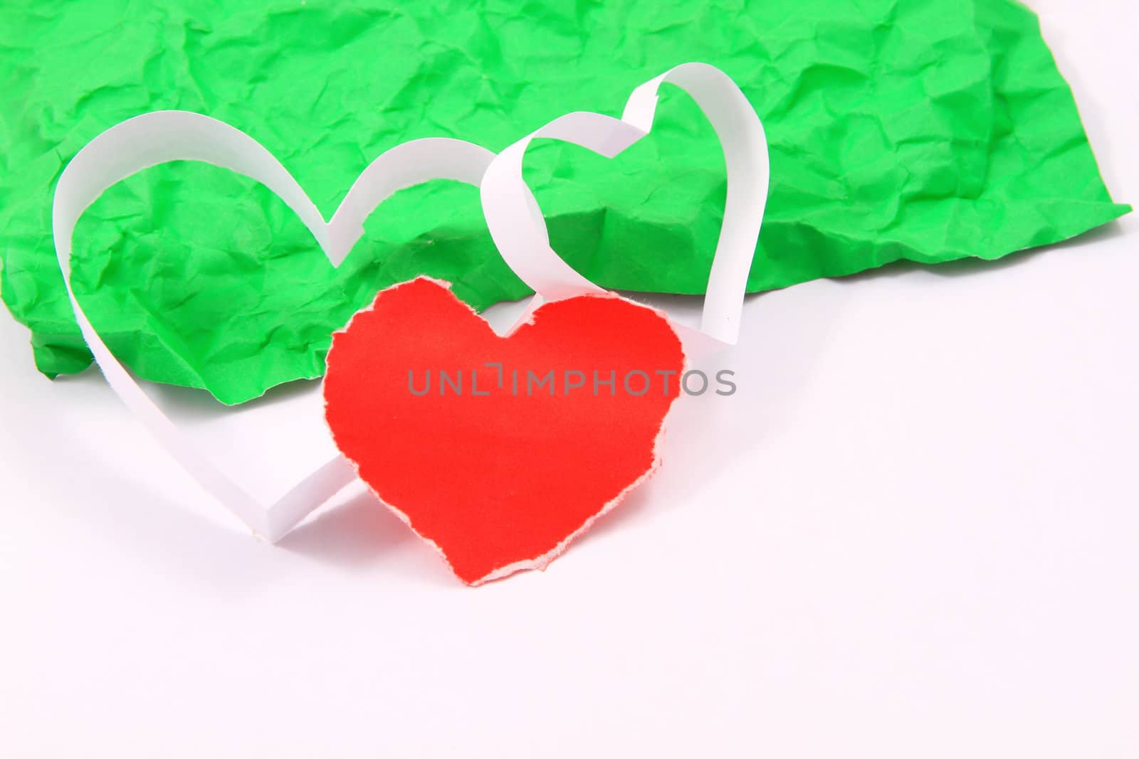 Paper hearts on white background by rufous