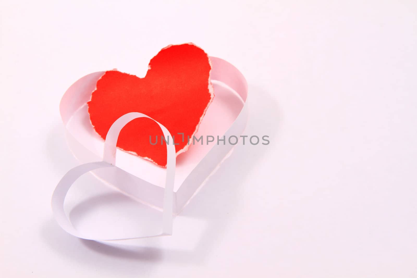 Paper hearts on white background