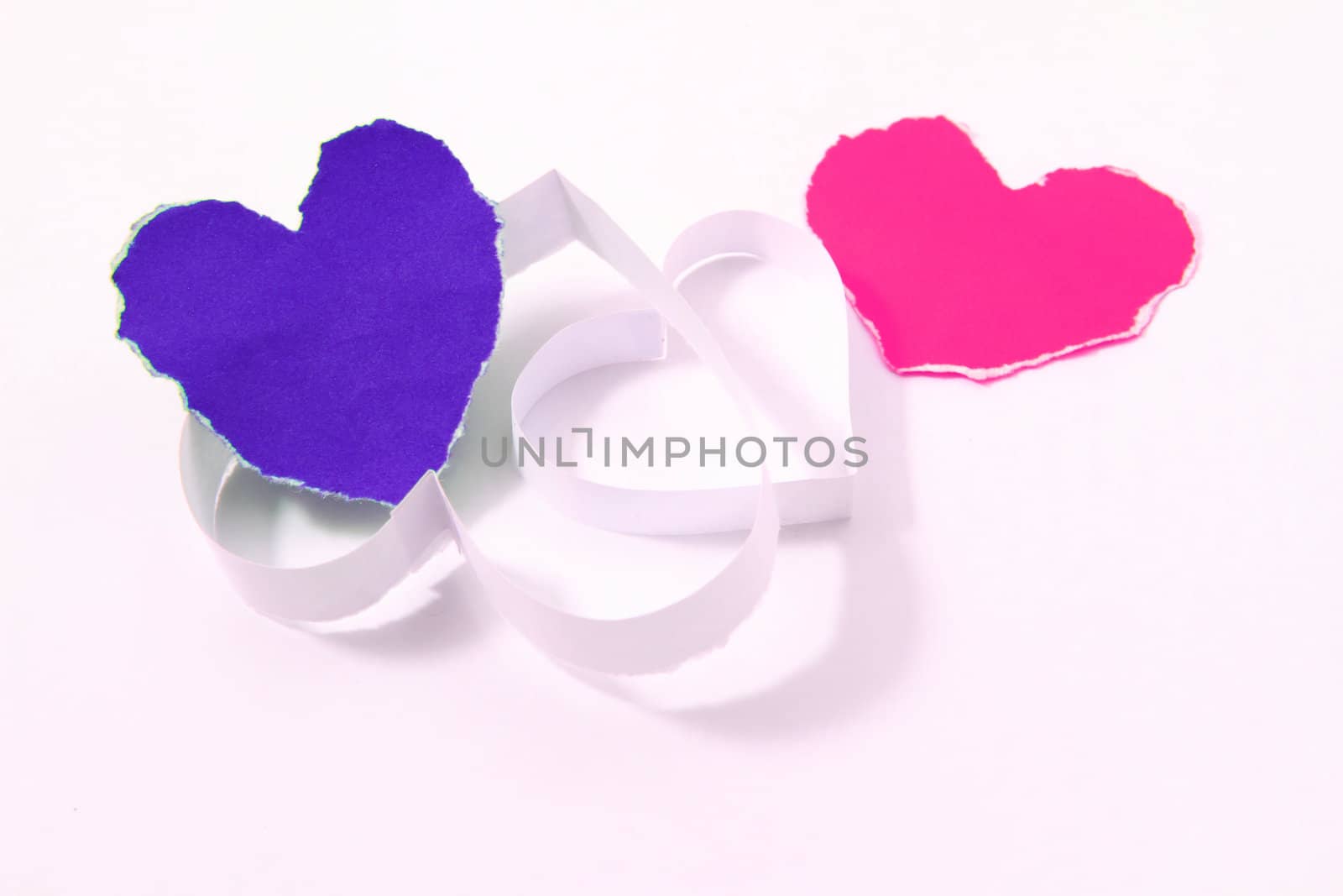 Paper hearts on white background by rufous
