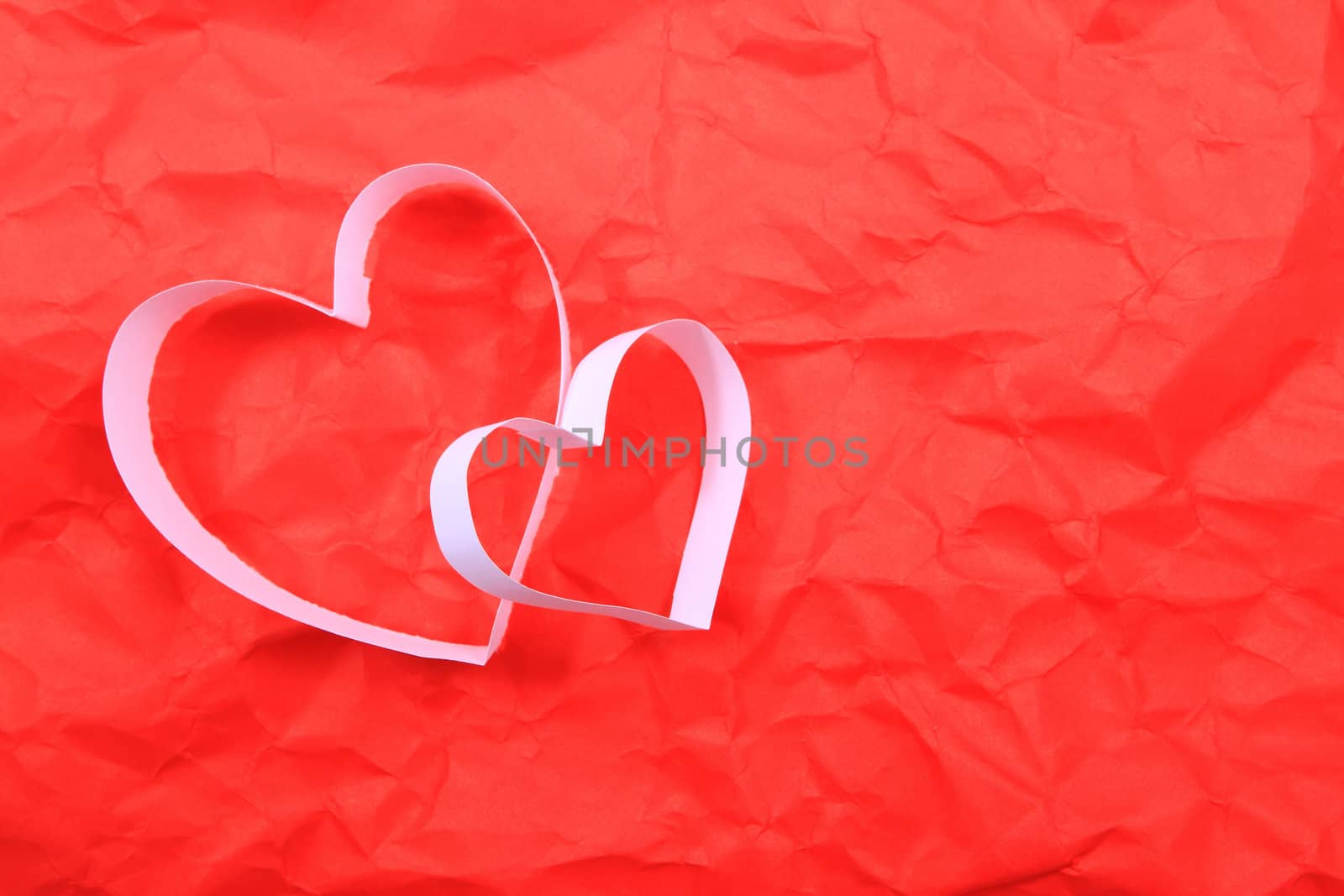 Paper hearts on red background