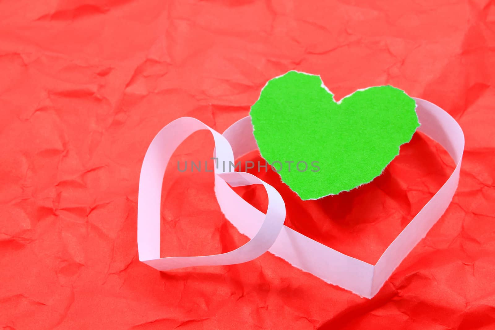 Paper hearts on red background