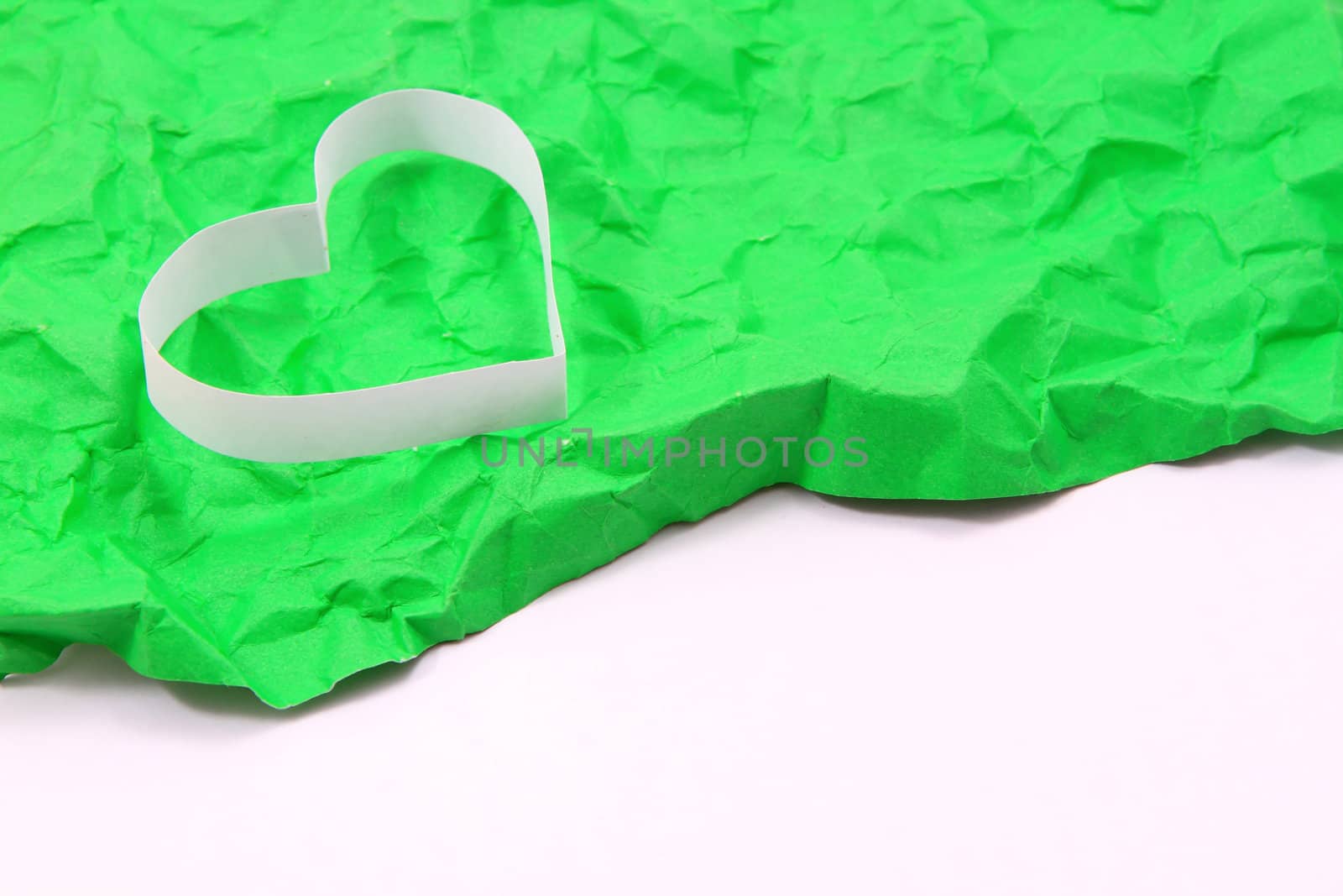 Paper hearts on green background